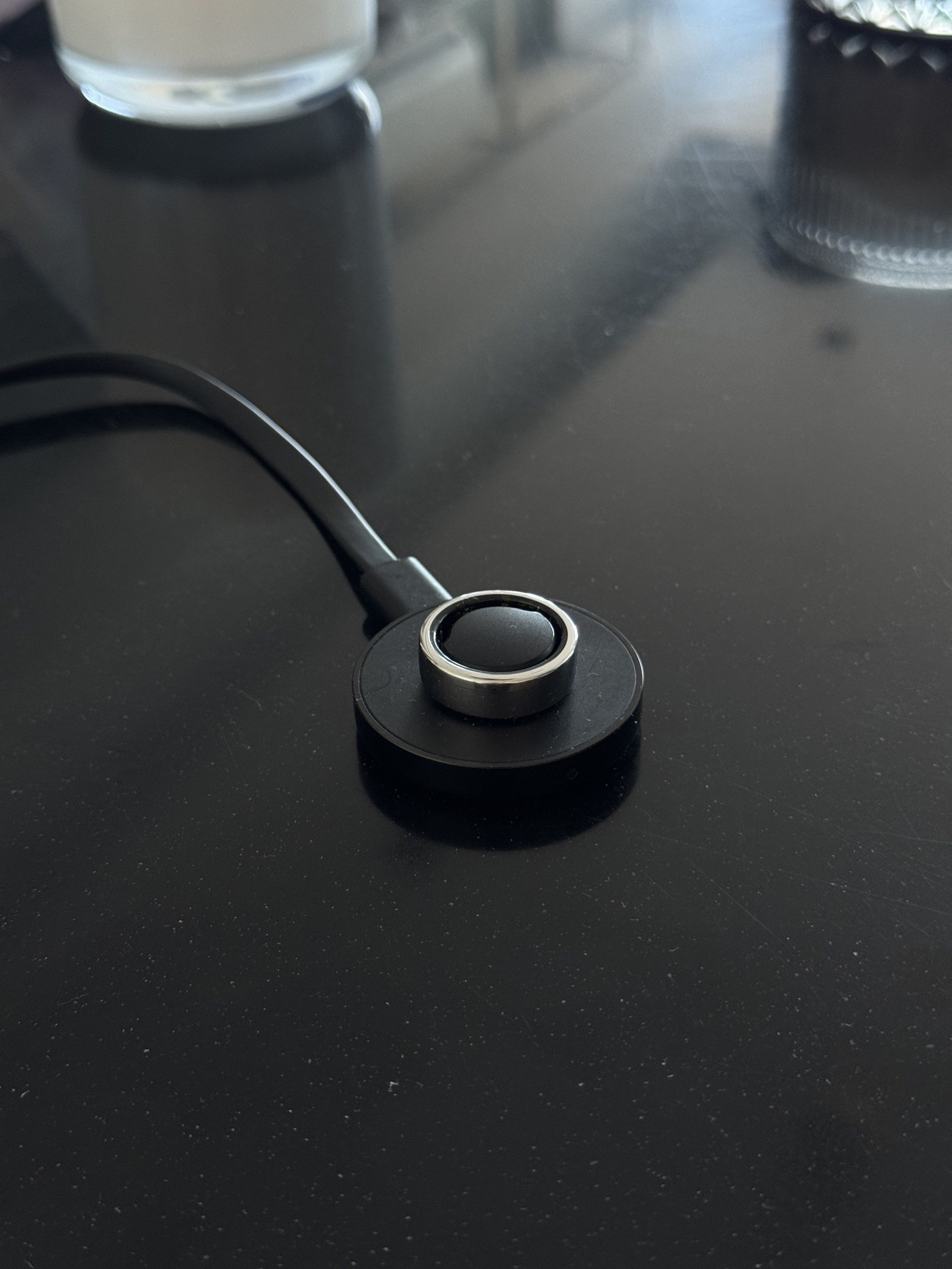 Oura Ring Gen 2 Silver Size 10 (Smart Ring with Charger) (Category: Sports & Fitness Nutrition) located in Makati City. Submitted by _btdeclutters (Listing ID 1418299866, Image 1). Description: - Smart ring with a modern, sleek design - Comes with a charging dock - Ring features a silver band - Charger is black and circular - Likely used for tracking health metrics - Well used, with visible scratches but 100% smooth no issue.