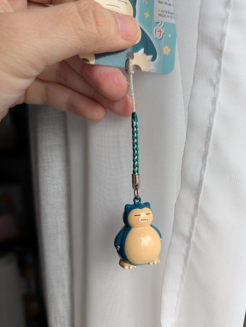 Pokemon Snorlax Keychain (Category: Character Goods) located in Quezon City. Submitted by charmerchant (Listing ID 1418288531, Image 2). Description: - Adorable Snorlax keychain! -with bell and sound - Features a detailed Snorlax figure. - Color scheme: Teal and beige. - Includes original tag. - Great accessory for keys, bags, or backpacks. - Perfect for Pokemon fans!.