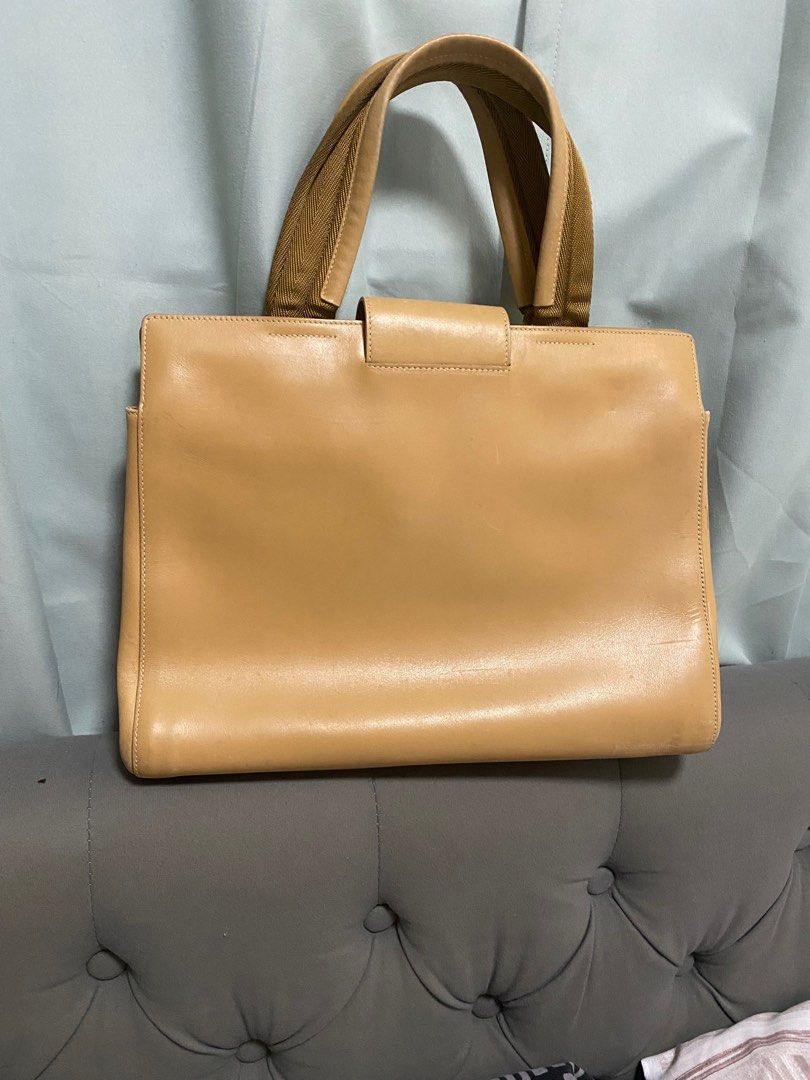Prada Handbag (Category: Luxury Bags & Wallets) located in Marikina City. Submitted by neltan_carousel (Listing ID 1418211940, Image 2). Description: Original Prada Bag • 💯% Original/Authentic • comes with a detachable pouch envelope • only flaw - with rubs/color loss (check 1st photo) •very clean interior • Inclusion/s: Carda .