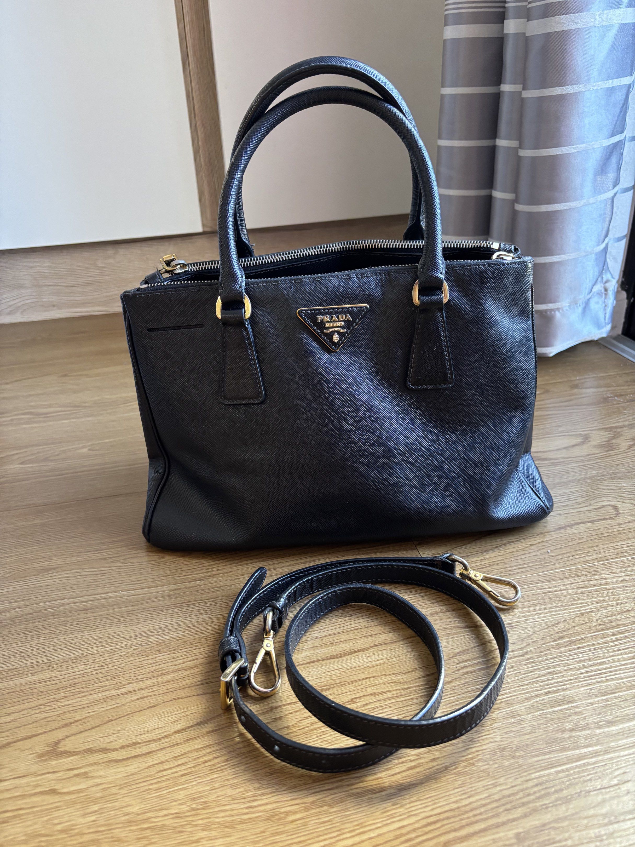 Prada Saffiano Galleria Small (Category: Luxury Bags & Wallets) located in Las Pinas. Submitted by itskat.cruz (Listing ID 1418391257, Image 1). Description: Authentic Prada Galleria in small size In very good condition (flaws: small cracks in the edging; cracked snap button but works fine) No inclusions.