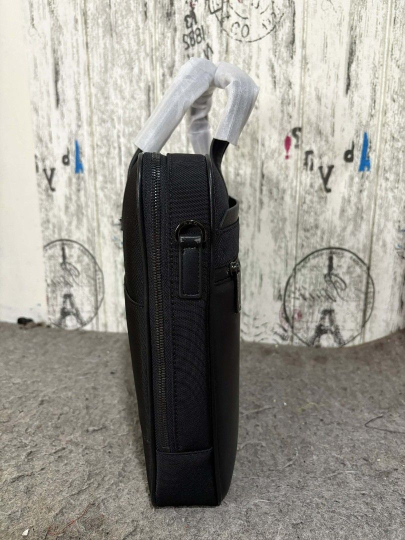 Samsonite Red Slim Briefcase 12x16x2 (Category: Briefcases) located in Manila. Submitted by jzjapansurplus (Listing ID 1418282443, Image 3). Description: - Original Samsonite Red slim briefcase - Black exterior - Zippered main compartment - Front zippered pocket - Detachable shoulder strap - Original packaging included - Dimensions: Approximately 12x16x2 inches.