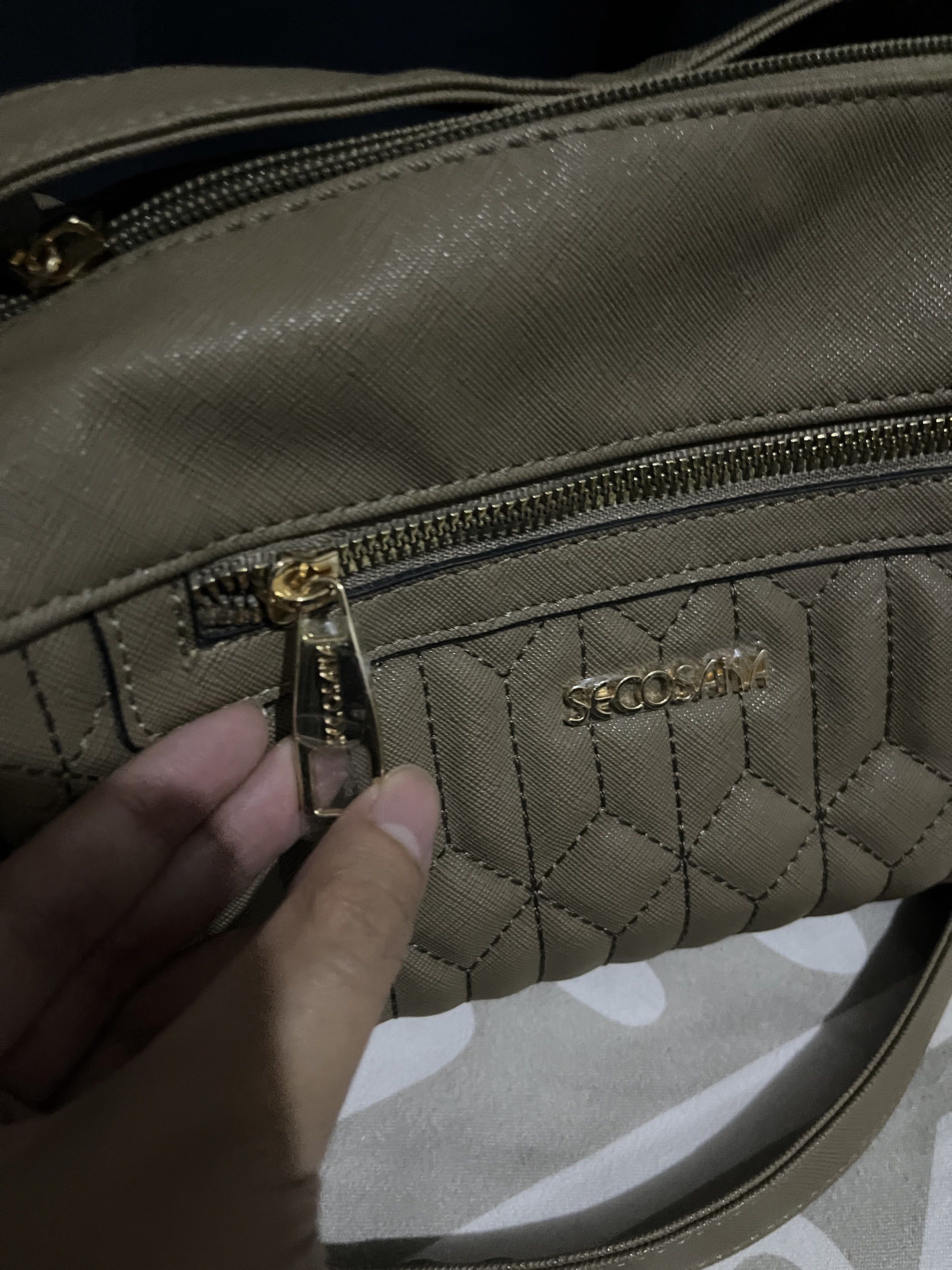 Secosana Taupe Crossbody Bag (Category: Cross-body Bags) located in Taguig. Submitted by chickendubu (Listing ID 1418337063, Image 2). Description: Secosana Taupe Quilted Crossbody Bag This was gifted to me two years ago and never been used kaya the hardwares are still covered in plastic. No signs of wear since di pa talaga nagagamit and nalalabas. Not really the type of bag that I’ll use since it isn’t in black, white or brown. Last pic for size