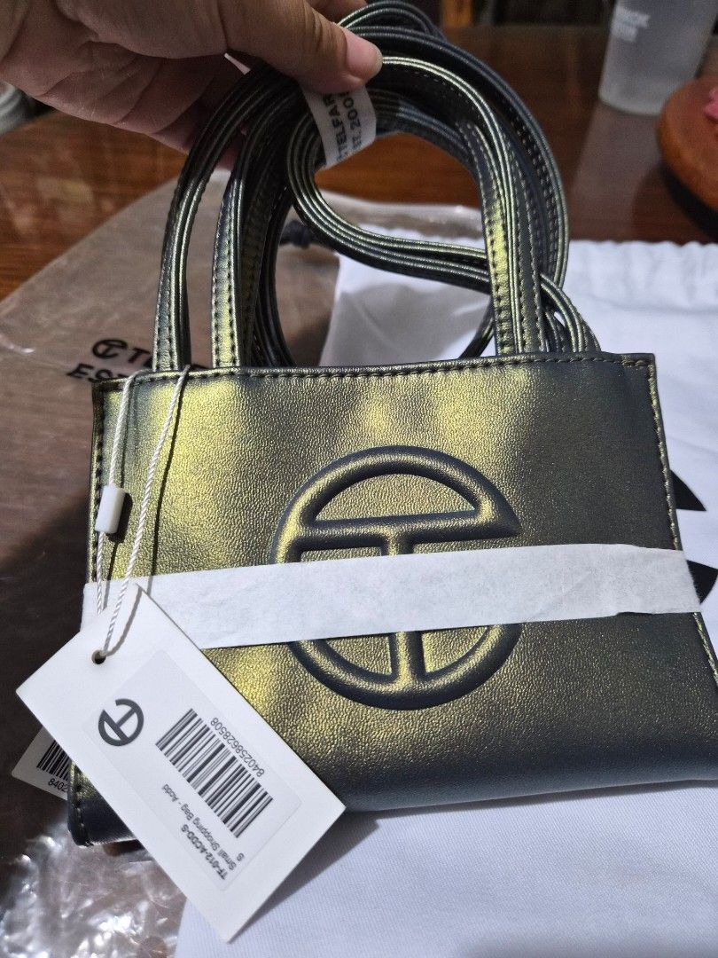 Telfar Small Shopping Bag (Category: Luxury Bags & Wallets) located in Makati City. Submitted by cecebeh (Listing ID 1418275523, Image 1). Description: Telfar - Small Shopping Bag in Acid - Bought in US - Authentic - Unique color, no counterfeits - Comes in original packaging with tag - Dustbag included - No issues! RFS: Size is not for me :(.