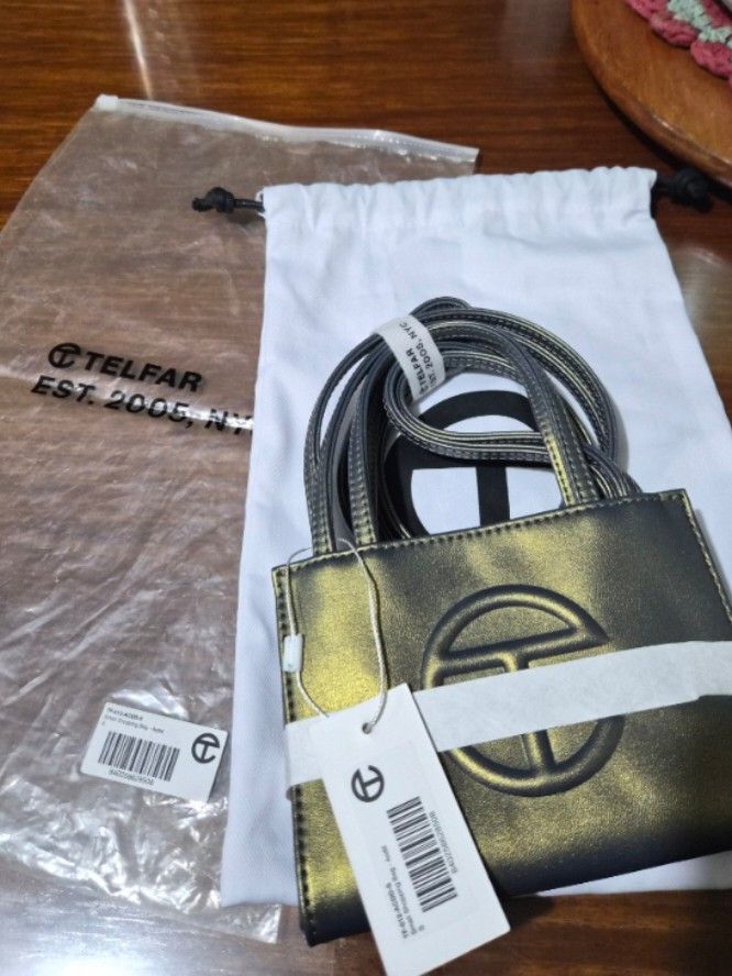 Telfar Small Shopping Bag (Category: Luxury Bags & Wallets) located in Makati City. Submitted by cecebeh (Listing ID 1418275523, Image 2). Description: Telfar - Small Shopping Bag in Acid - Bought in US - Authentic - Unique color, no counterfeits - Comes in original packaging with tag - Dustbag included - No issues! RFS: Size is not for me :(.