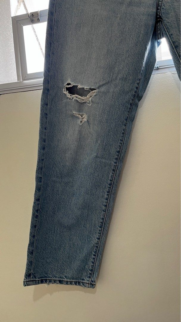 Uniqlo Ripped Denim Jeans (Category: Jeans) located in Naga. Submitted by lilycheedeclutter (Listing ID 1418239119, Image 3). Description: - Light wash denim jeans - Ripped knees - Button and zipper closure - Two front and back pockets - Straight leg fit - Distressed hem.
