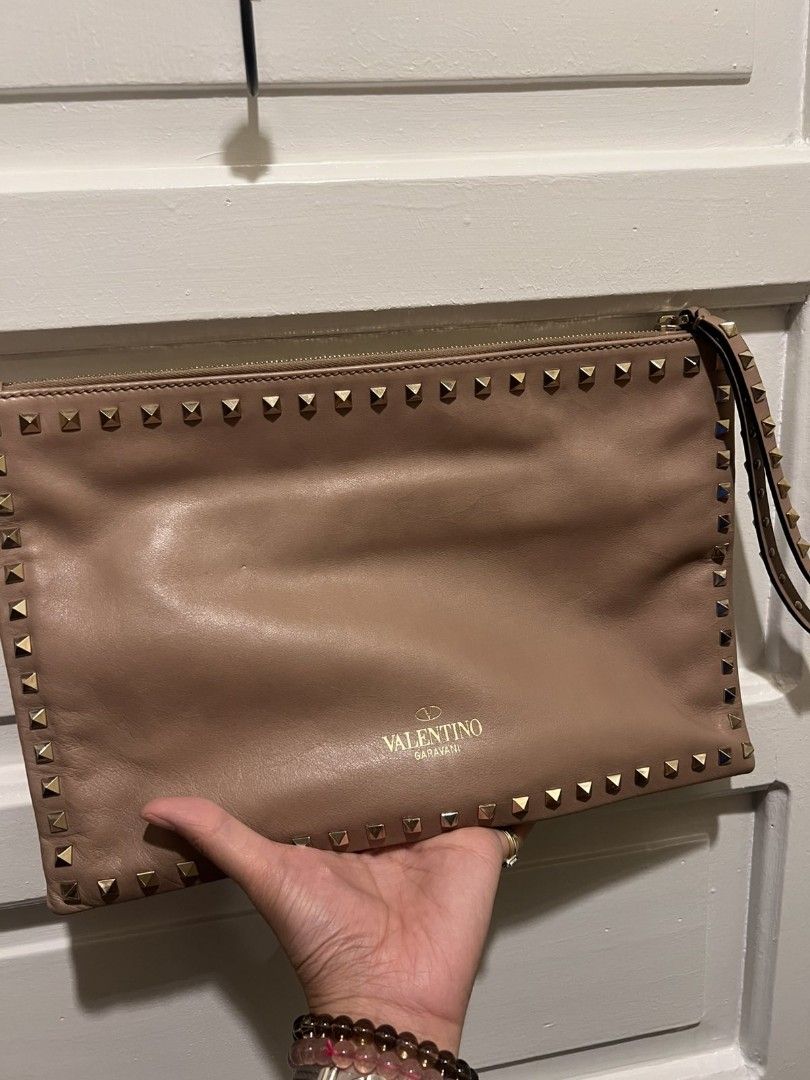 Valentino Leather Studded Clutch Bag (Category: Luxury Bags & Wallets) located in Paranaque City. Submitted by bagbrained88 (Listing ID 1418374082, Image 1). Description: 100% original beautiful piece in actual.