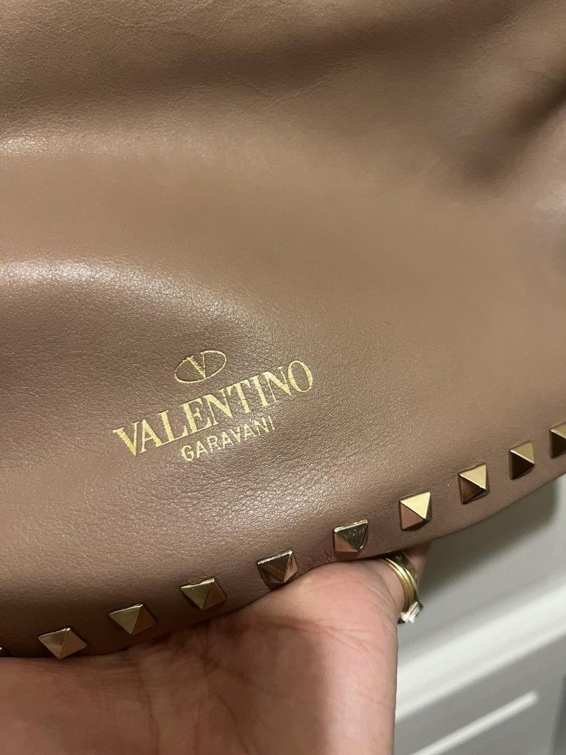 Valentino Leather Studded Clutch Bag (Category: Luxury Bags & Wallets) located in Paranaque City. Submitted by bagbrained88 (Listing ID 1418374082, Image 2). Description: 100% original beautiful piece in actual.