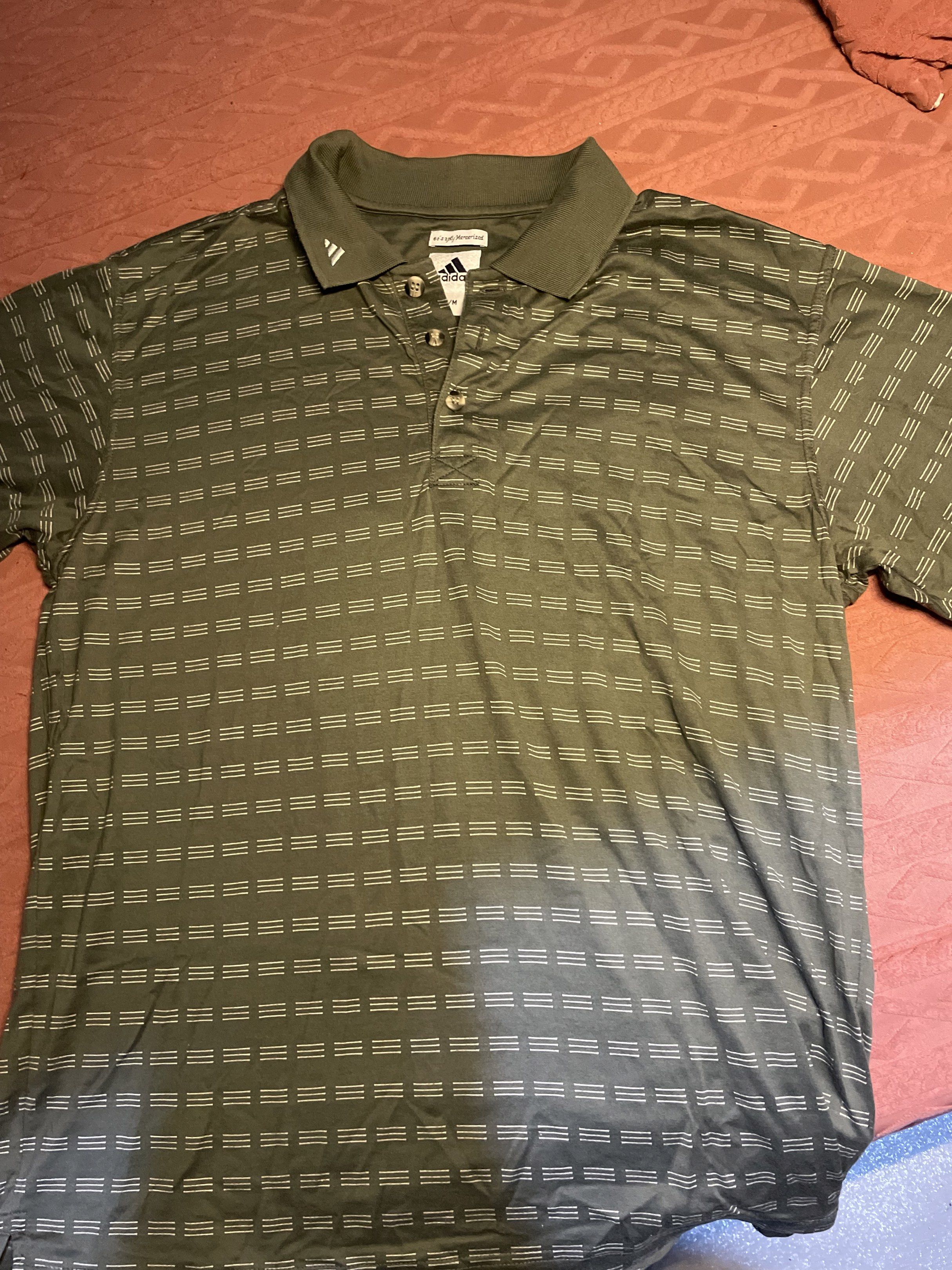 Vintage Adidas Polo Shirt Medium (Category: Tshirts & Polo Shirts ) located in Quezon City. Submitted by augustus666 (Listing ID 1418294370, Image 3). Description: - Adidas polo shirt - Olive green color - Geometric pattern - Adidas logo on chest and collar - Collared neckline - Button-down closure - Size: M-L.