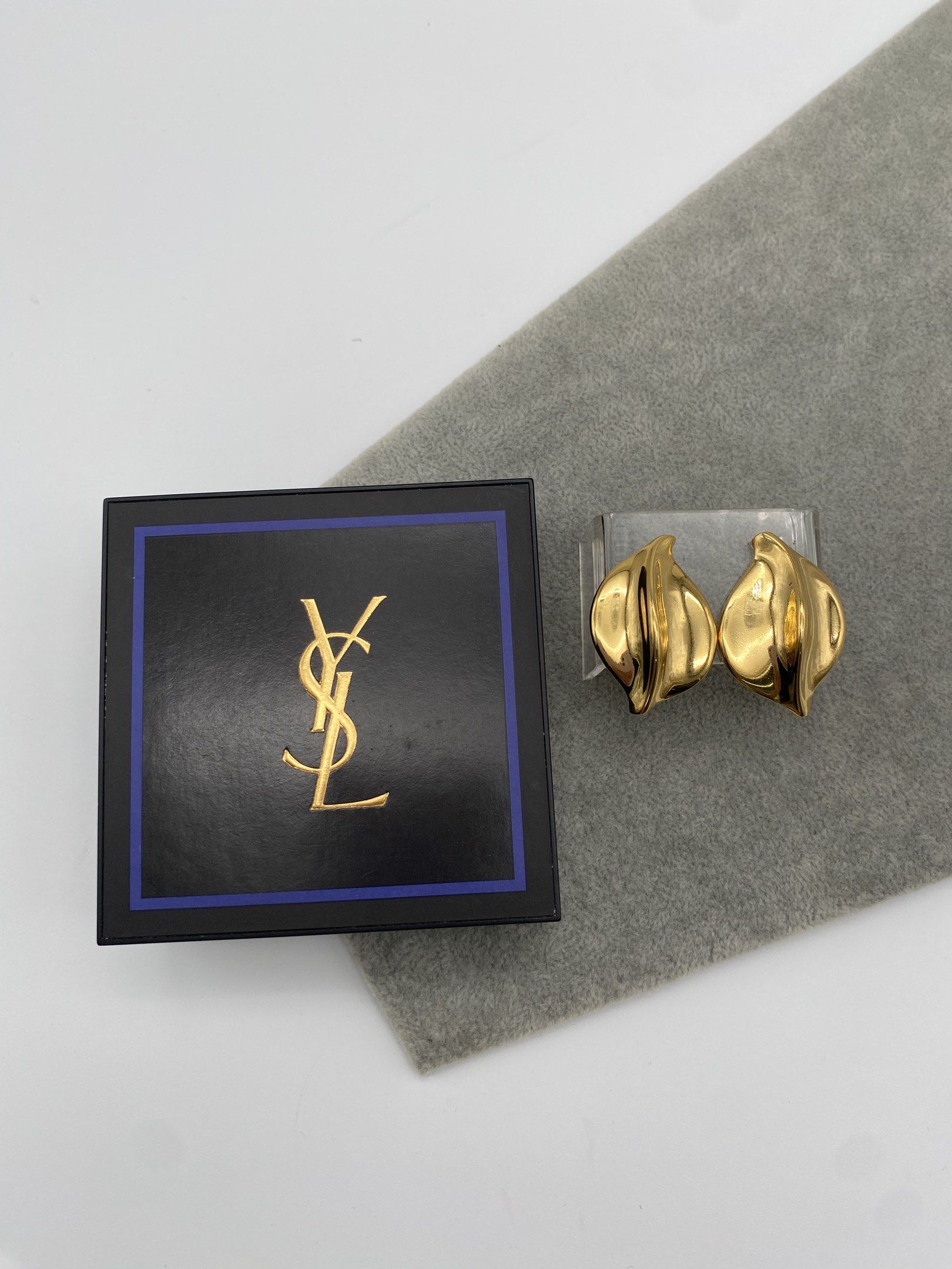 Vintage signed YSL statement clip on earrings (Category: Luxury Accessories) located in Quezon City. Submitted by vintagebymatilde (Listing ID 1418403761, Image 1). Description: ⚜️Vintage YSL clip on earrings. Signed on the clip backs and inner part. 1.5x1.2” in size. High quality. Authentic. Excellent condition. Rare pair sourced from Tokyo. DISCLAIMER All items posted in are previously owned. They are all categorized as vintage, antique or prel