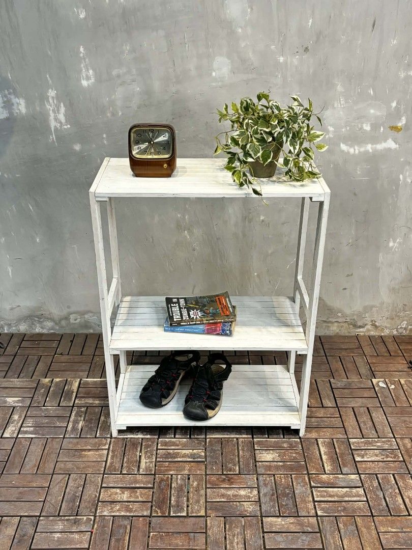 White Wooden 3-Tier Shelf (Category: Shelves, Cabinets & Racks) located in Manila. Submitted by upcycle_things (Listing ID 1418283486, Image 2). Description: - White wooden shelf - 3-tier design - Slatted style - Sturdy frame - Great for books, plants, and decor - Adds storage and style - Simple and clean white design.