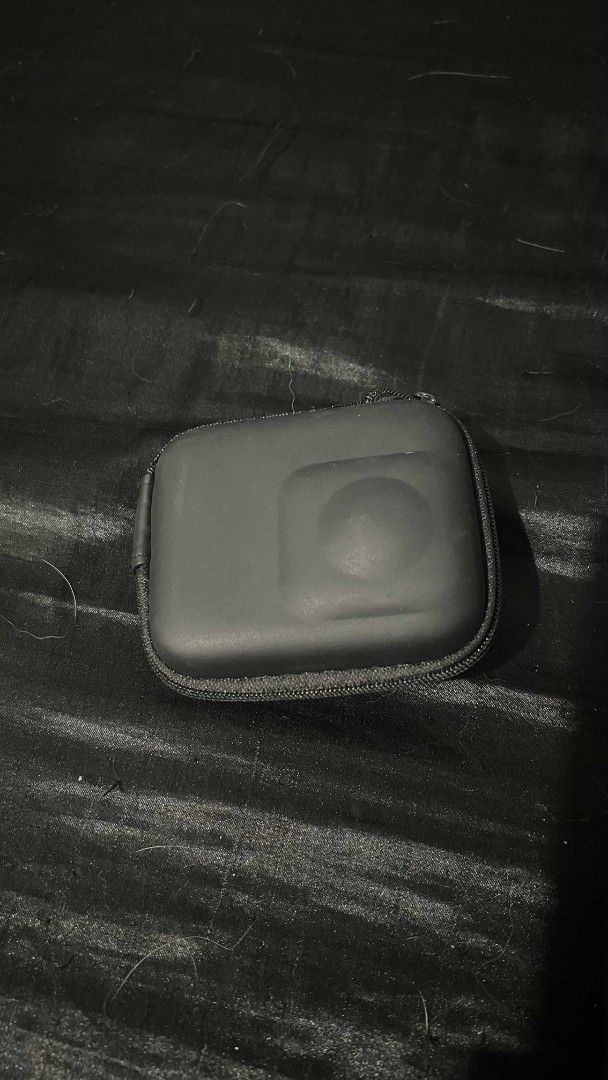 Action Camera Case (Category: Camera Bags & Carriers) located in Quezon City. Submitted by seeeen (Listing ID 1418557557, Image 1). Description: Black camera case with a zipper closure. The interior has molded compartments. The case is designed to protect a camera. It is compact and easy to carry..