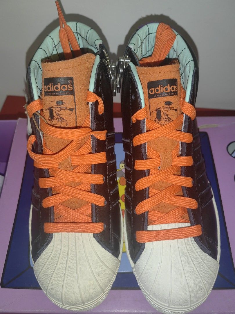 Adidas The Simpsons Pro Model Sneakers (Category: Sneakers) located in Makati City. Submitted by flubby09 (Listing ID 1418511747, Image 1). Description: - Adidas Pro Model sneakers, The Simpsons collaboration - Black leather upper - Orange laces - White toe cap - Side zipper - The Simpsons branding on tongue and heel - Size 36 - Comes with original box.