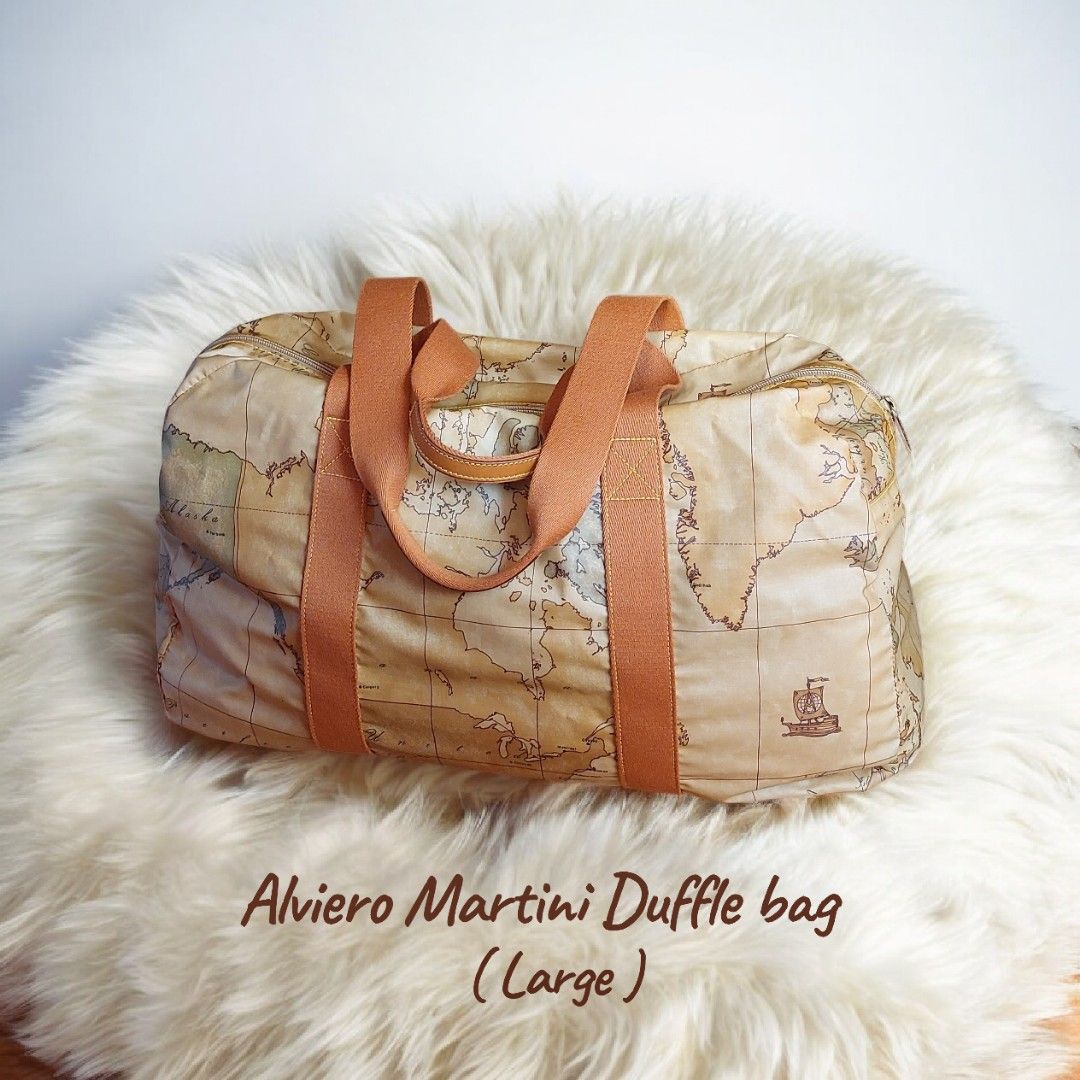 Alviero Martini Large Duffle Bag (Category: Luxury Bags & Wallets) located in Davao. Submitted by wengbagstuff (Listing ID 1418495269, Image 1). Description: 🍀 in printed fabric with iconic geopraphical map 🍀 in very good condition, no tear or holes nor rubs. 🍀 large travel bag .