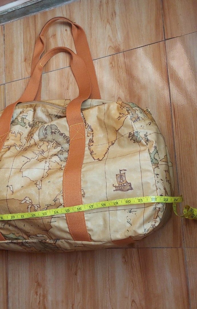 Alviero Martini Large Duffle Bag (Category: Luxury Bags & Wallets) located in Davao. Submitted by wengbagstuff (Listing ID 1418495269, Image 3). Description: 🍀 in printed fabric with iconic geopraphical map 🍀 in very good condition, no tear or holes nor rubs. 🍀 large travel bag .