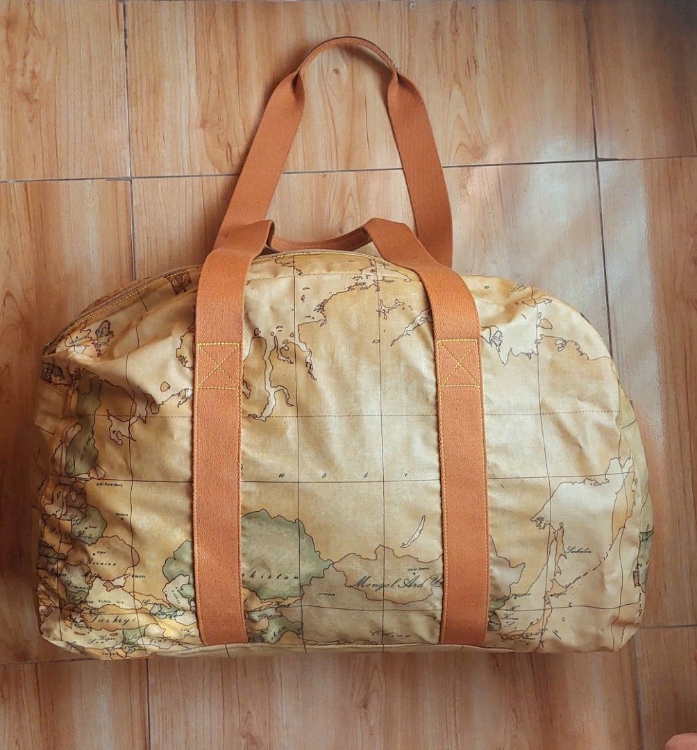 Alviero Martini Large Duffle Bag (Category: Luxury Bags & Wallets) located in Davao. Submitted by wengbagstuff (Listing ID 1418495269, Image 2). Description: 🍀 in printed fabric with iconic geopraphical map 🍀 in very good condition, no tear or holes nor rubs. 🍀 large travel bag .
