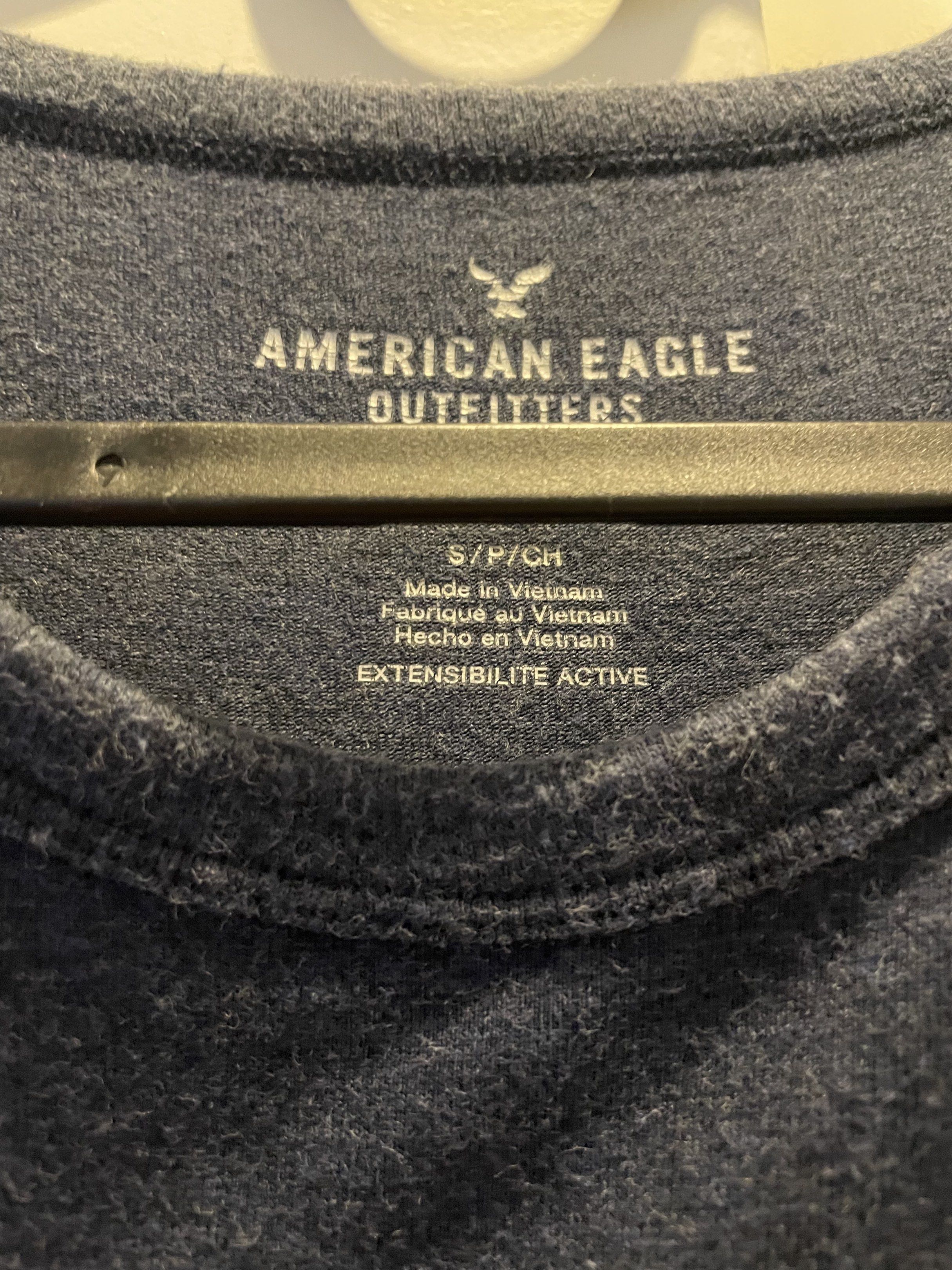American Eagle Outfitters Active Flex T-shirt (Category: Tshirts & Polo Shirts ) located in Las Pinas. Submitted by bmtl_ (Listing ID 1418526315, Image 3). Description: American Eagle Outfitters Active Flex T-shirt. Features a navy blue base with pink and white horizontal stripes across the chest. Made in Vietnam. Size S/P/CH. The shirt has a crew neck and short sleeves..