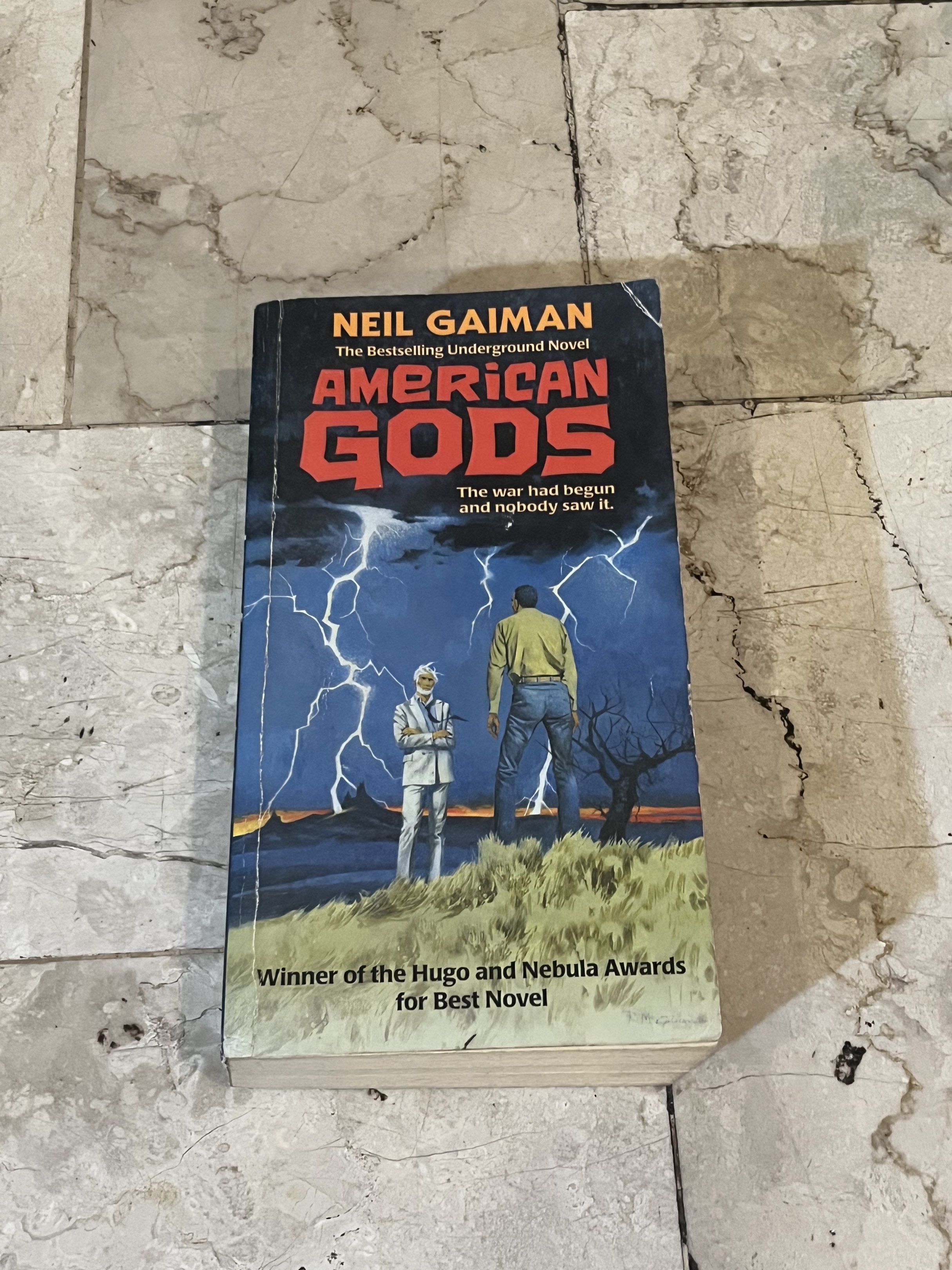 American Gods by Neil Gaiman (Category: Storybooks) located in Quezon City. Submitted by rinn_a (Listing ID 1418451875, Image 1). Description: Minor erasing on page 1 (see pic). Lalamove in QC area only!.