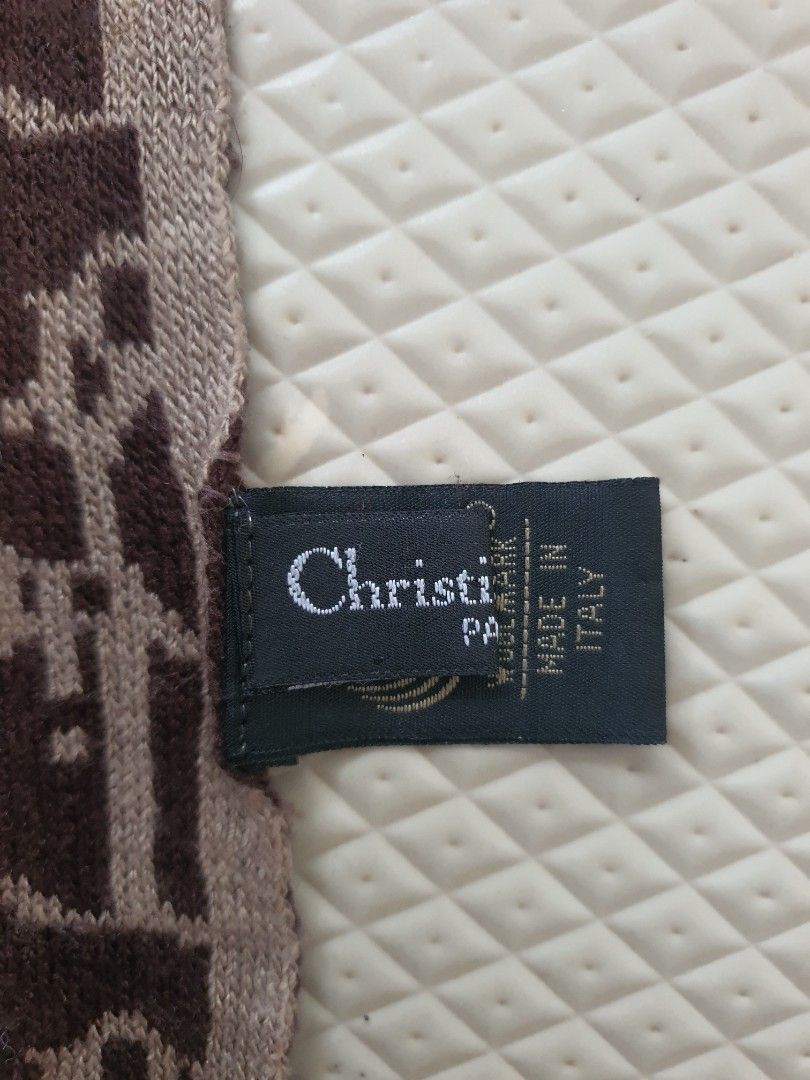Authentic Christian Dior Oblique muffler Scarf (Category: Scarves) located in Cagayan de Oro. Submitted by real_luxe (Listing ID 1418466273, Image 3). Description: - Authentic Christian Dior scarf - Features the iconic Oblique pattern - Made in Italy - Color scheme: Brown and beige - Brand tag visible - Made of a soft, luxurious material.