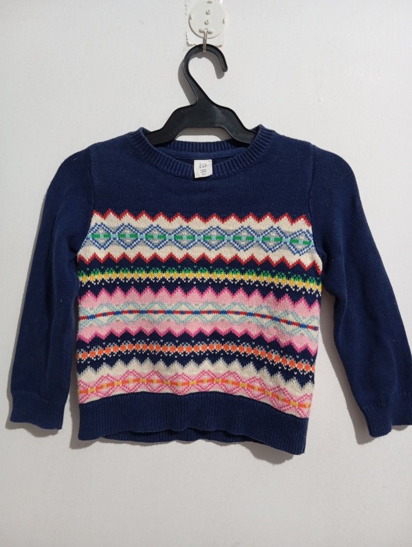 Baby GAP Multicolor Toddler Sweater (Category: Babies & Kids Fashion) located in Muntinlupa City. Submitted by challasy (Listing ID 1418513012, Image 1). Description: -Baby GAP sweater for 4-year-old toddler - Navy blue base color - Features a colorful patterned design on the chest - Long sleeves - Crew neck sweater.