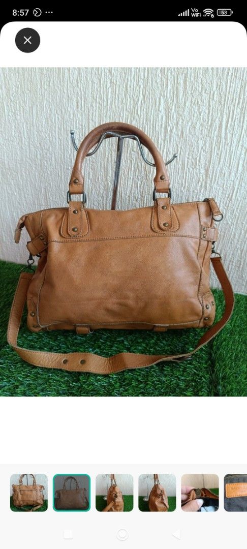 Balenciaga Paris Leather Handbag (Category: Luxury Bags & Wallets) located in Mangaldan. Submitted by mceseucap18107 (Listing ID 1418418247, Image 3). Description: - Balenciaga Paris handbag - Genuine leather - Top handle and detachable shoulder strap - Front zip pocket - Main compartment with zip closure - Metal studs and hardware.