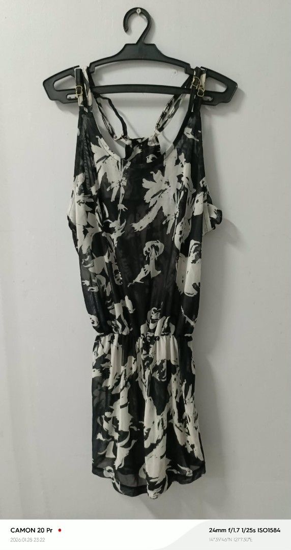 Black and White Floral Romper beach attire (Category: Rompers) located in Quezon City. Submitted by sheila0721 (Listing ID 1418465340, Image 2). Description: - Black and white floral print romper - Sleeveless design - Gathered waist - Thin straps that cross at the back - Lightweight fabric - One-piece outfit - Ideal for warm weather.