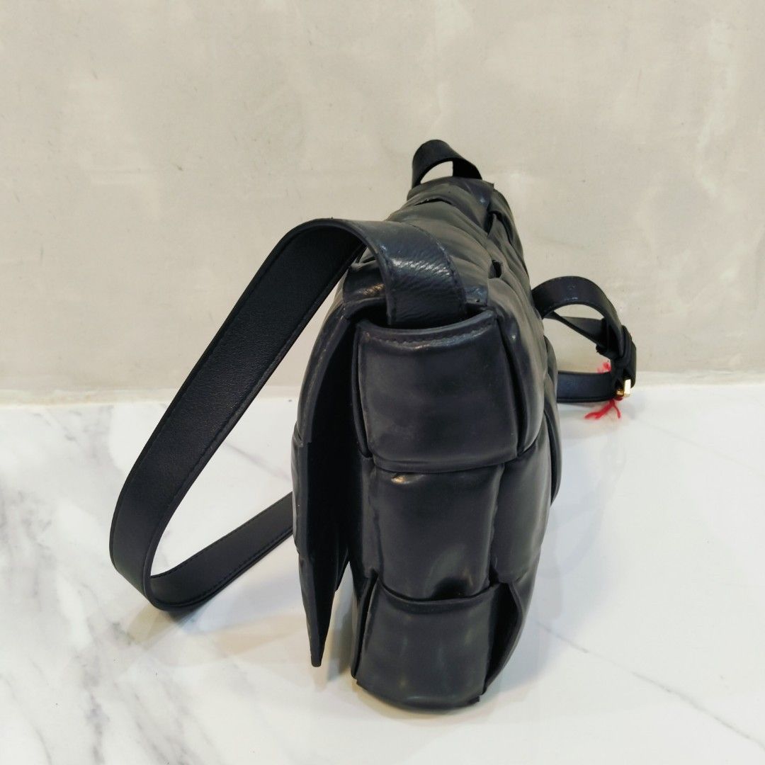 Bottega Veneta Padded Cassette Bag (Category: Luxury Bags & Wallets) located in Dagupan City. Submitted by youngthrift_ (Listing ID 1418497871, Image 2). Description: - Bottega Veneta Padded Cassette Bag - Color: Black - Design: Woven - Hardware: Gold-tone - Interior: Zipper pocket - Made in Italy - Shoulder strap included - Serial number: B00881424X - issue sign of used.