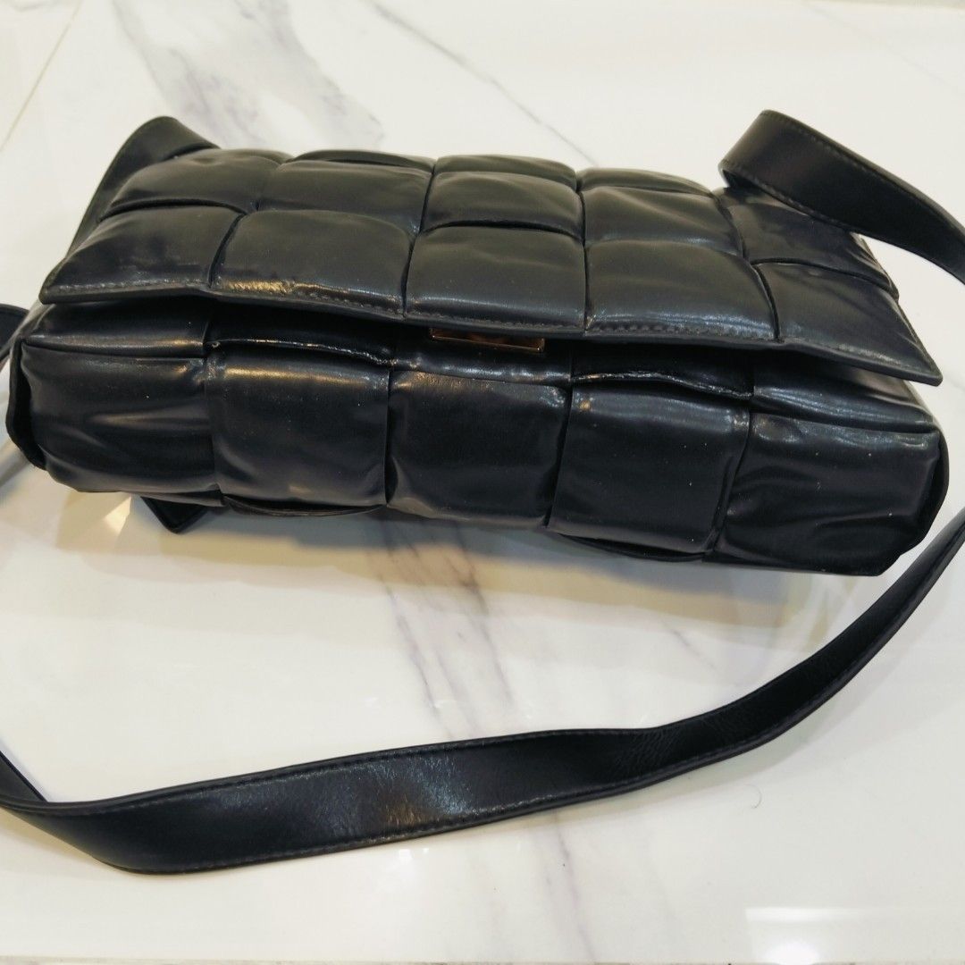 Bottega Veneta Padded Cassette Bag (Category: Luxury Bags & Wallets) located in Dagupan City. Submitted by youngthrift_ (Listing ID 1418497871, Image 3). Description: - Bottega Veneta Padded Cassette Bag - Color: Black - Design: Woven - Hardware: Gold-tone - Interior: Zipper pocket - Made in Italy - Shoulder strap included - Serial number: B00881424X - issue sign of used.