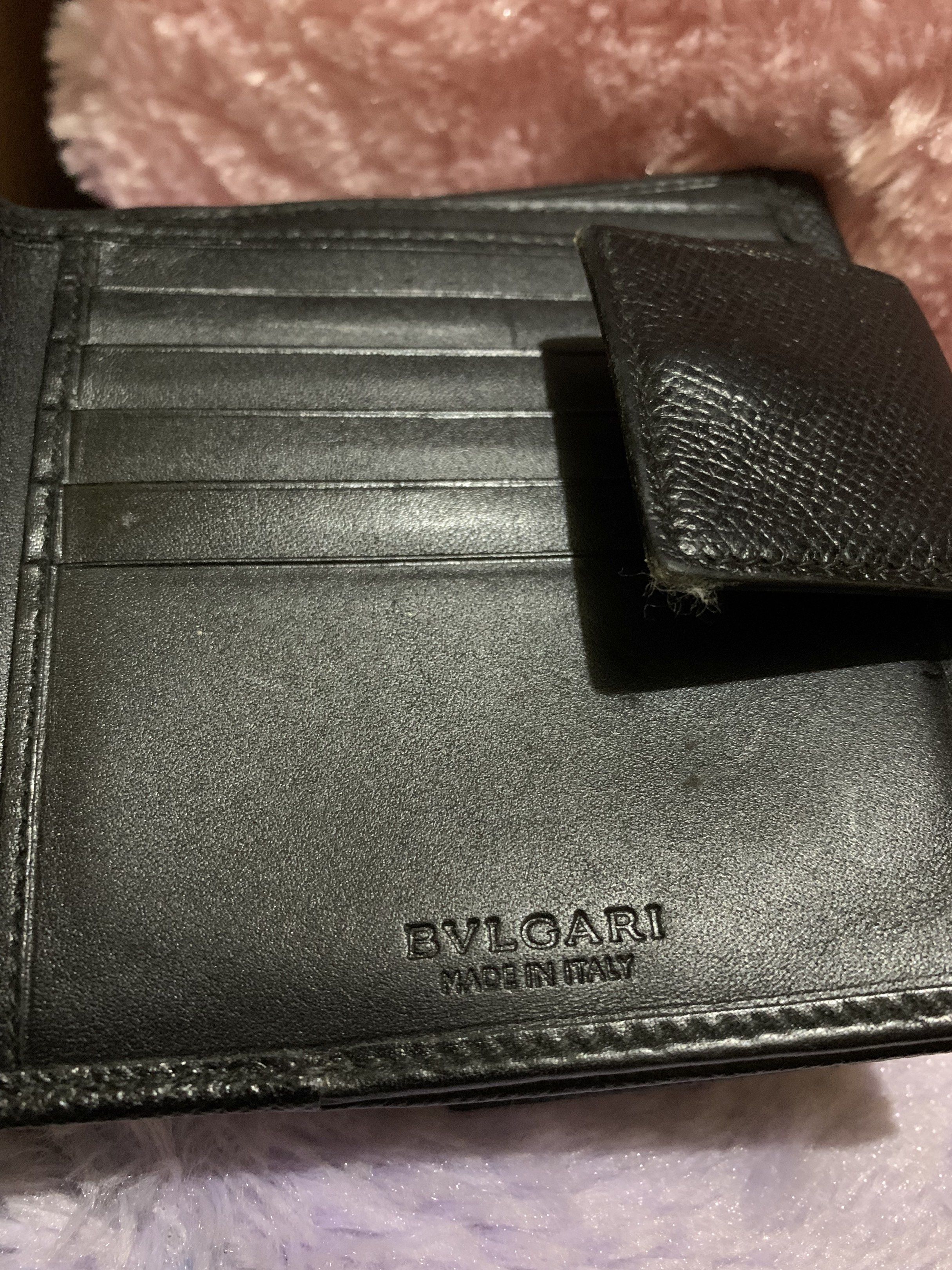 Bvlgari Black Leather Wallet (Category: Luxury Bags & Wallets) located in Quezon City. Submitted by ncjnc (Listing ID 1418555472, Image 3). Description: - Authentic Bvlgari wallet - Black leather - Silver-tone clasp - Multiple card slots - Coin compartment - "BVLGARI MADE IN ITALY" embossed inside - High-quality, textured leather.