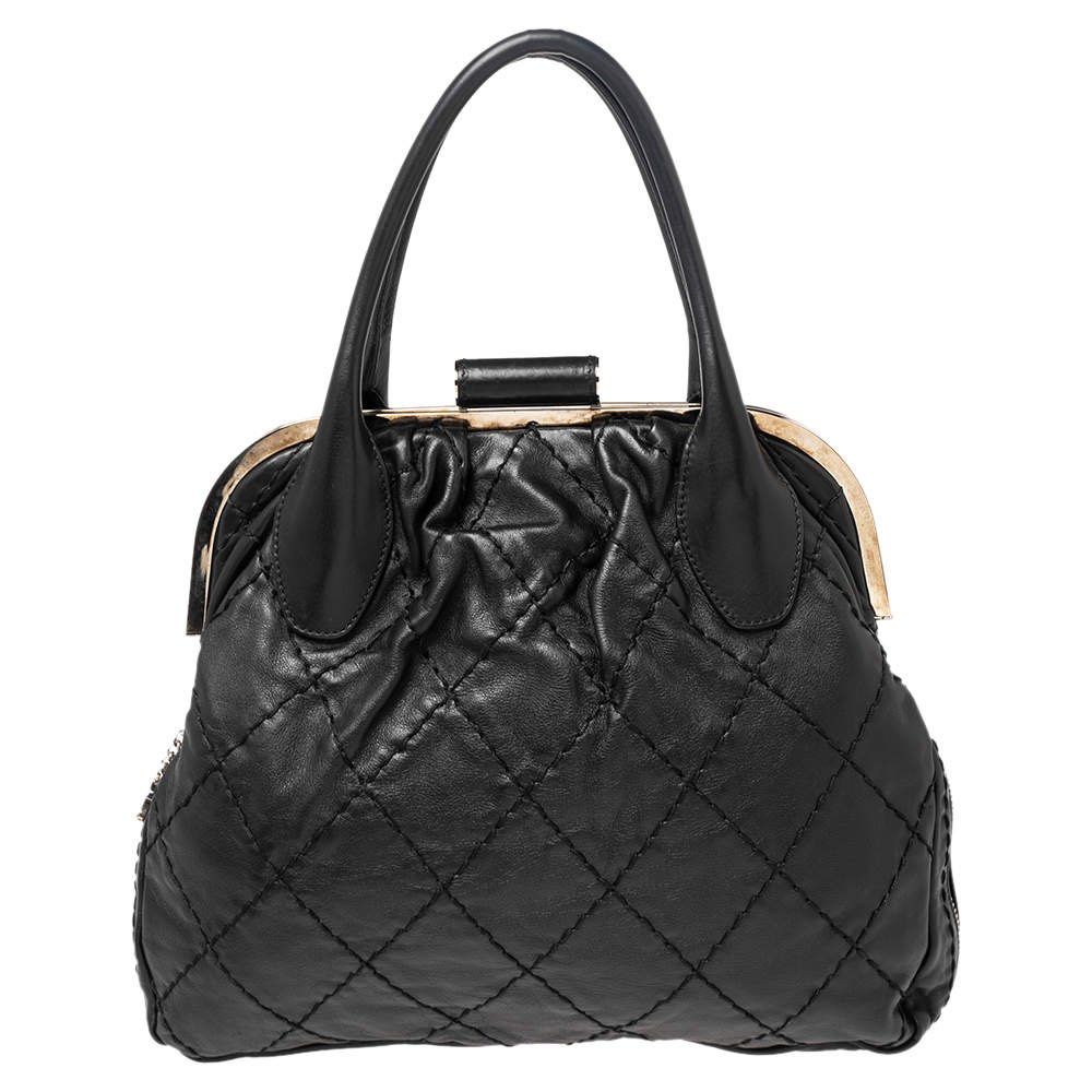 Chanel Quilted Leather Handbag (Category: Luxury Bags & Wallets) located in Manila. Submitted by andreaaarut (Listing ID 1418523847, Image 1). Description: - Black quilted leather handbag - Features a gold-tone clasp - Iconic Chanel logo - Structured shape with diamond-stitched pattern - Top handle design.