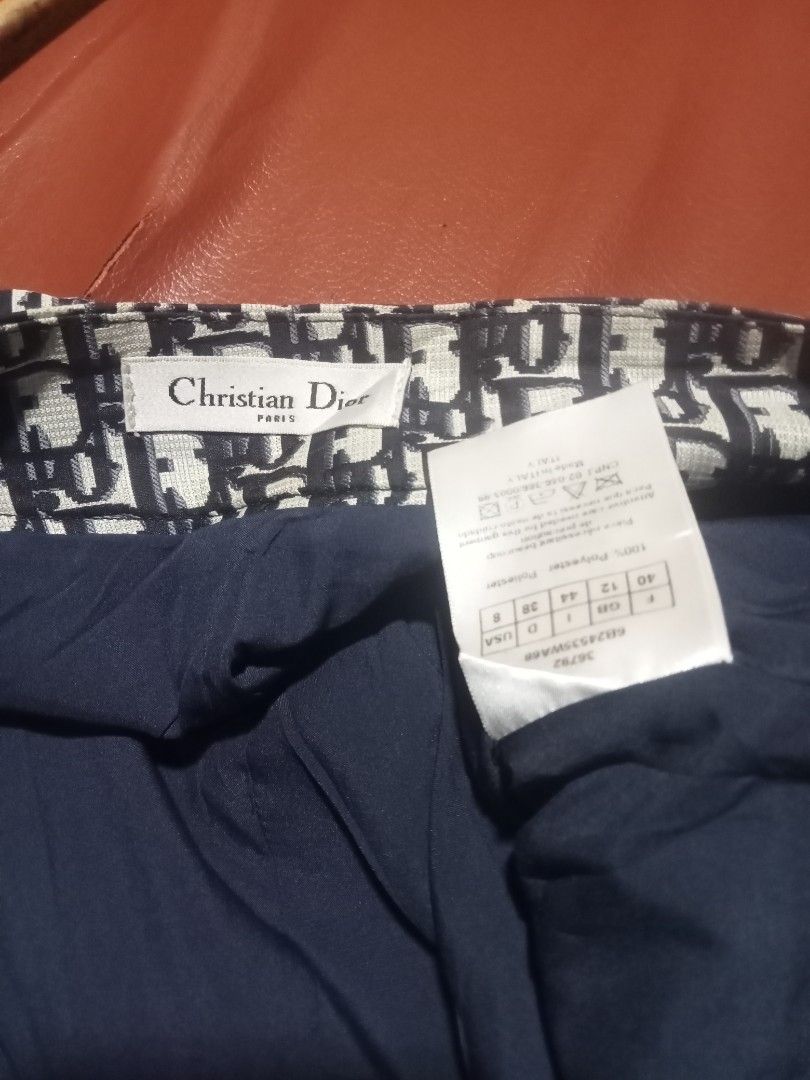 Christian Dior Skirt (Category: Luxury Apparel) located in Sagay. Submitted by kennie_3377 (Listing ID 1418405074, Image 2). Description: - Christian Dior skirt - Signature Dior print - Pleated design - Features diagonal "Christian Dior" logo - Navy blue lining - Size 8 - A stylish addition to your wardrobe.