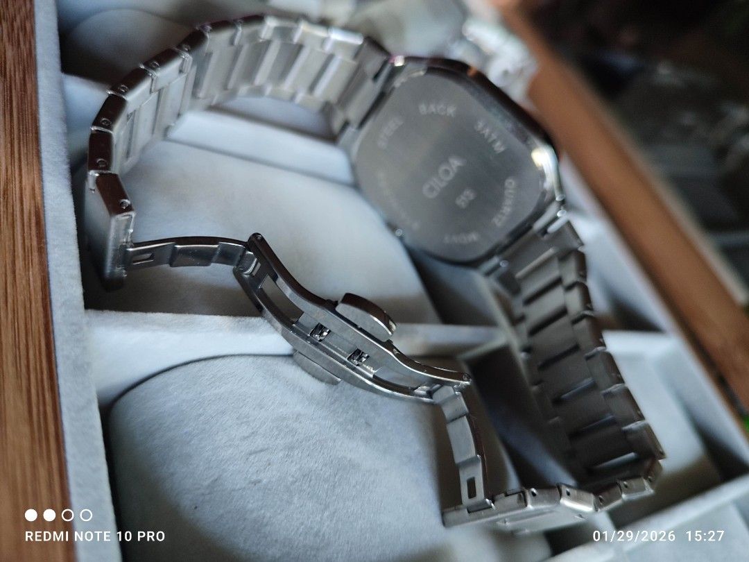 Ciloa Stainless Steel Watch (Category: Men's Watches) located in Mangaldan. Submitted by michelle_2004 (Listing ID 1418475428, Image 2). Description: - Ciloa watch with a unique square face - Features a sleek black dial - Durable stainless steel band - Water resistant up to 5 ATM - Distinctive time display.