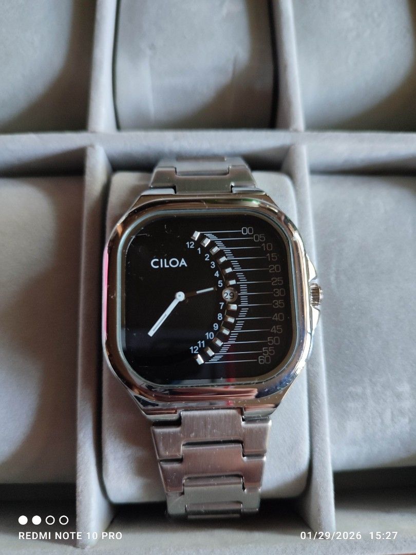 Ciloa Stainless Steel Watch (Category: Men's Watches) located in Mangaldan. Submitted by michelle_2004 (Listing ID 1418475428, Image 1). Description: - Ciloa watch with a unique square face - Features a sleek black dial - Durable stainless steel band - Water resistant up to 5 ATM - Distinctive time display.