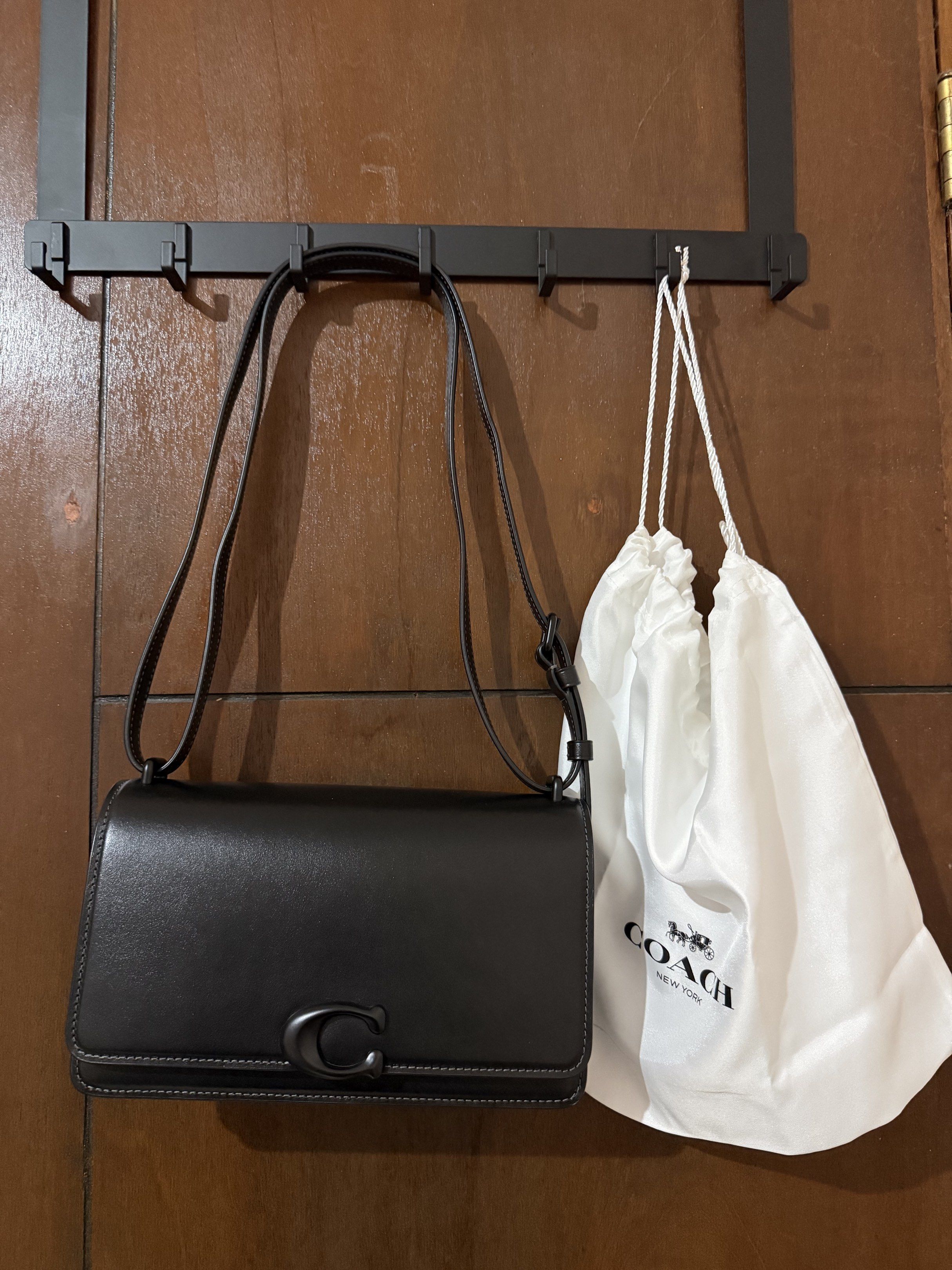 Coach Bandit Shoulder Bag (Category: Luxury Bags & Wallets) located in Paranaque City. Submitted by aaaaa_earth (Listing ID 1418537747, Image 1). Description: Black Coach Bandit shoulder bag. Features a flap closure with a turnlock. Includes a detachable shoulder strap. The interior is lined and has a slip pocket. Comes with a dust bag. Color: All Black Full Leather made of full grain leather. Just search the Coach Bandit Bag..