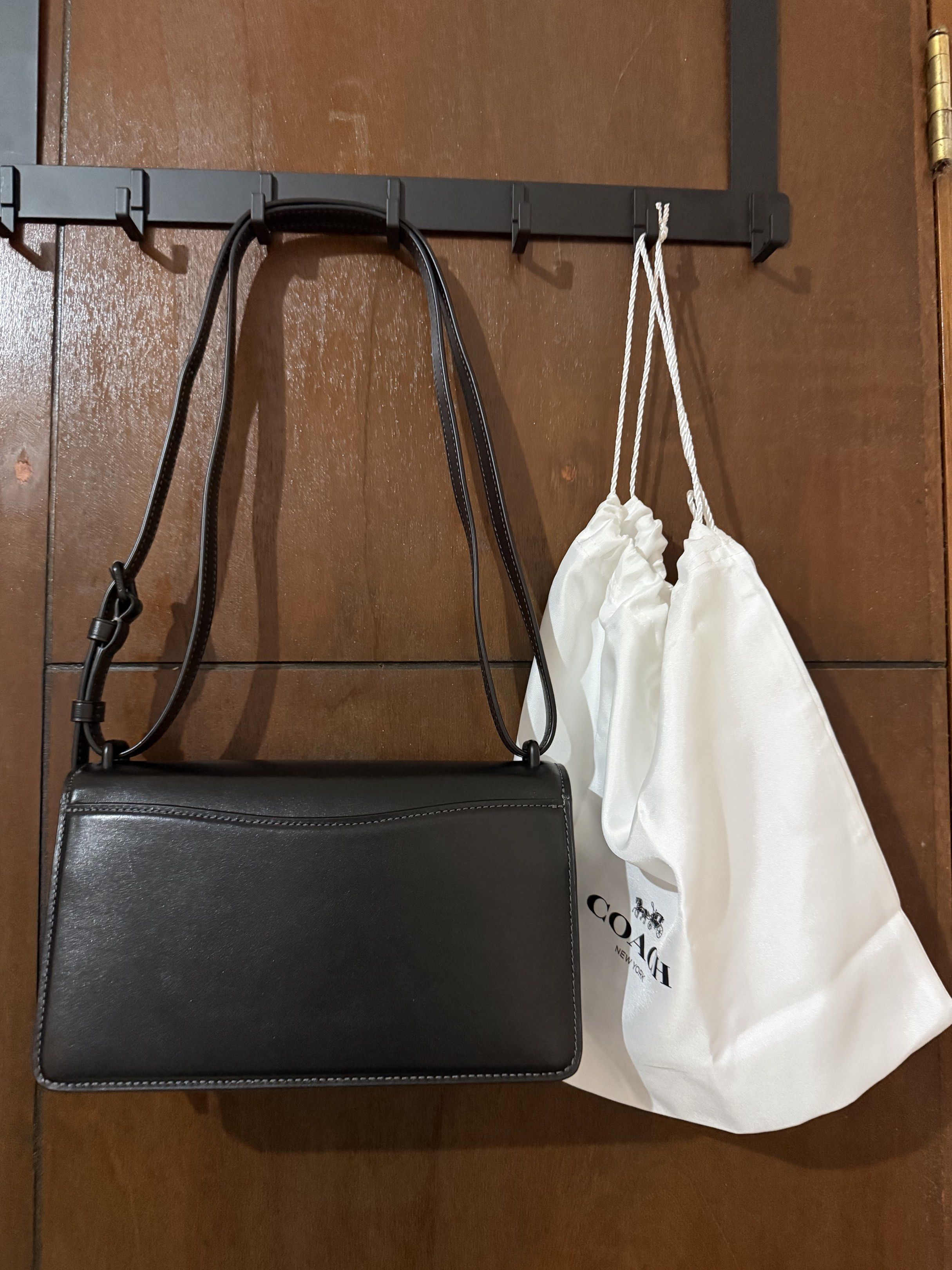 Coach Bandit Shoulder Bag (Category: Luxury Bags & Wallets) located in Paranaque City. Submitted by aaaaa_earth (Listing ID 1418537747, Image 2). Description: Black Coach Bandit shoulder bag. Features a flap closure with a turnlock. Includes a detachable shoulder strap. The interior is lined and has a slip pocket. Comes with a dust bag. Color: All Black Full Leather made of full grain leather. Just search the Coach Bandit Bag..