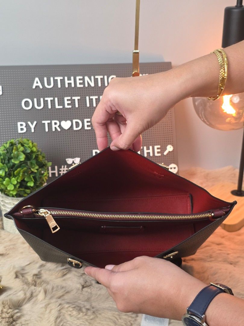 Coach Mollie 25 Tote Bag (Category: Luxury Bags & Wallets) located in Pasig City. Submitted by maryjanegr (Listing ID 1418453639, Image 2). Description: - Black Coach tote bag - Red interior - Detachable straps - Gold-tone hardware - Coach hang tag included - Made of textured leather.