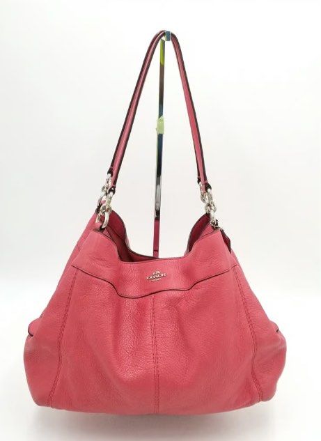 Coach Pink Leather Handbag (Category: Luxury Bags & Wallets) located in Manila. Submitted by andreaaarut (Listing ID 1418514349, Image 2). Description: - Authentic Coach handbag - Soft pink color - Spacious interior - Double handles - Subtle Coach logo - Textured leather.