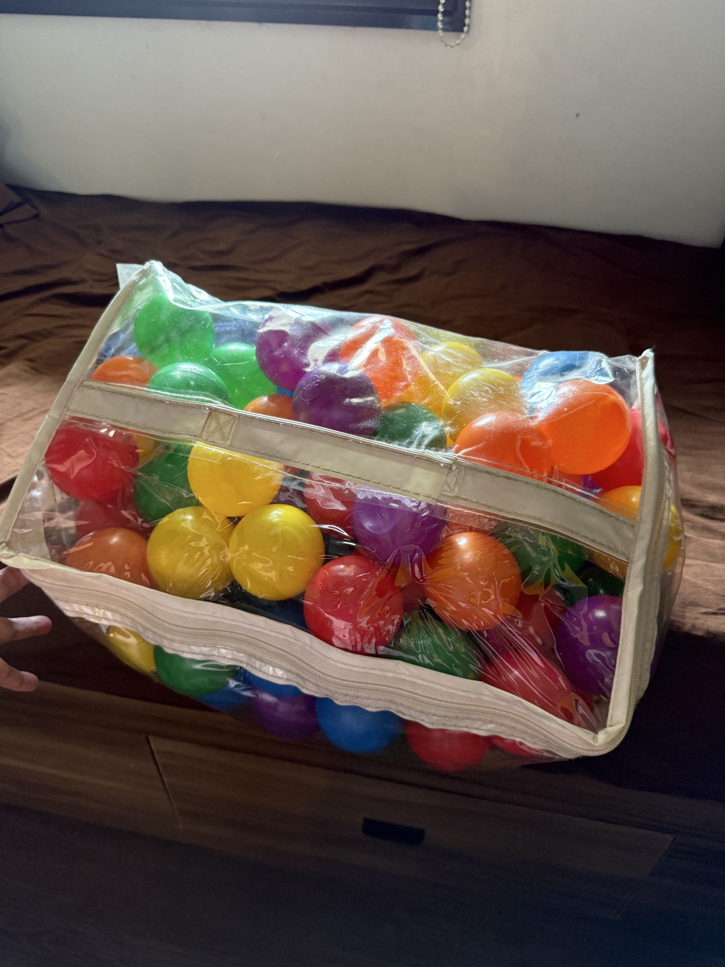 Colorful Play Balls in Bag (Category: Infant Playtime) located in Manila. Submitted by daveeh (Listing ID 1418475793, Image 2). Description: - Colorful play balls in red, orange, yellow, green, blue, and purple. - Comes in a clear plastic bag with a handle. - Ideal for kids' play areas and ball pits..