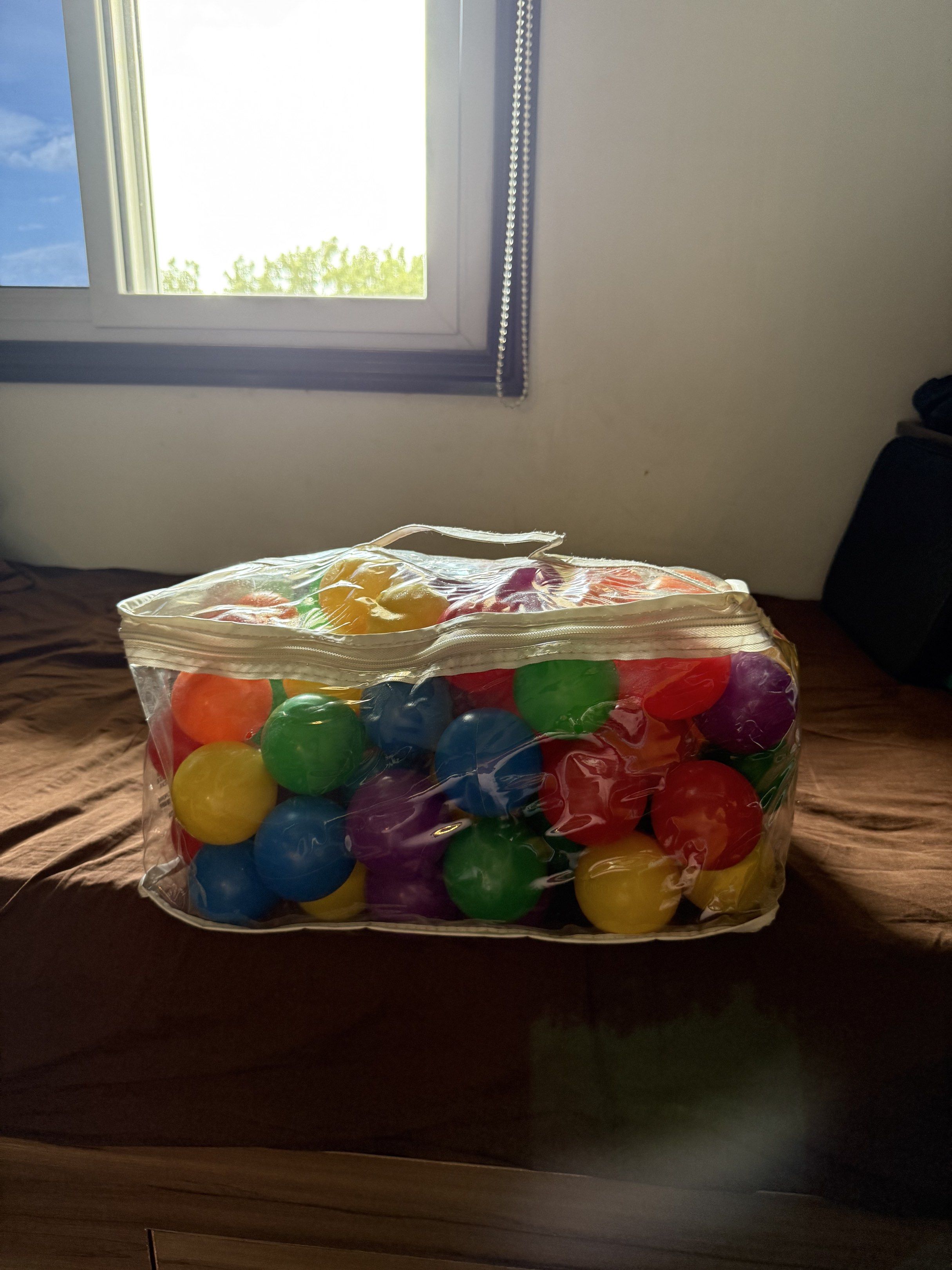 Colorful Play Balls in Bag (Category: Infant Playtime) located in Manila. Submitted by daveeh (Listing ID 1418475793, Image 1). Description: - Colorful play balls in red, orange, yellow, green, blue, and purple. - Comes in a clear plastic bag with a handle. - Ideal for kids' play areas and ball pits..