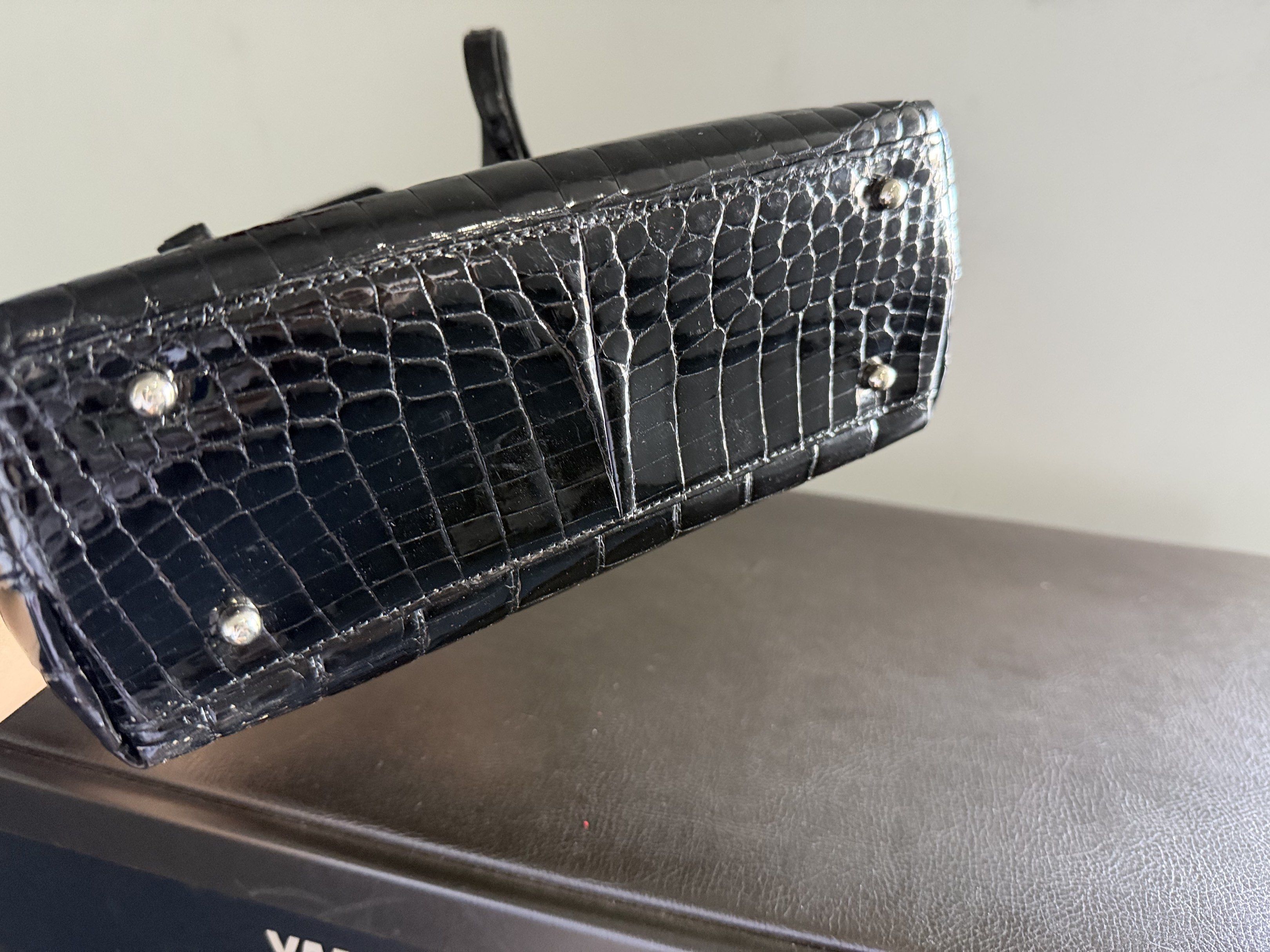Crocodile Leather JRA Bag 2Way (Category: Luxury Bags & Wallets) located in Quezon City. Submitted by 18john (Listing ID 1418487522, Image 3). Description: - crocodile leather handbag - Top handle and detachable shoulder strap - YKK zippers - Silver-toned hardware - Protective feet - Neutral interior lining - Brand tag inside - Ferragamo homage design -signs of usage as this is a used item .