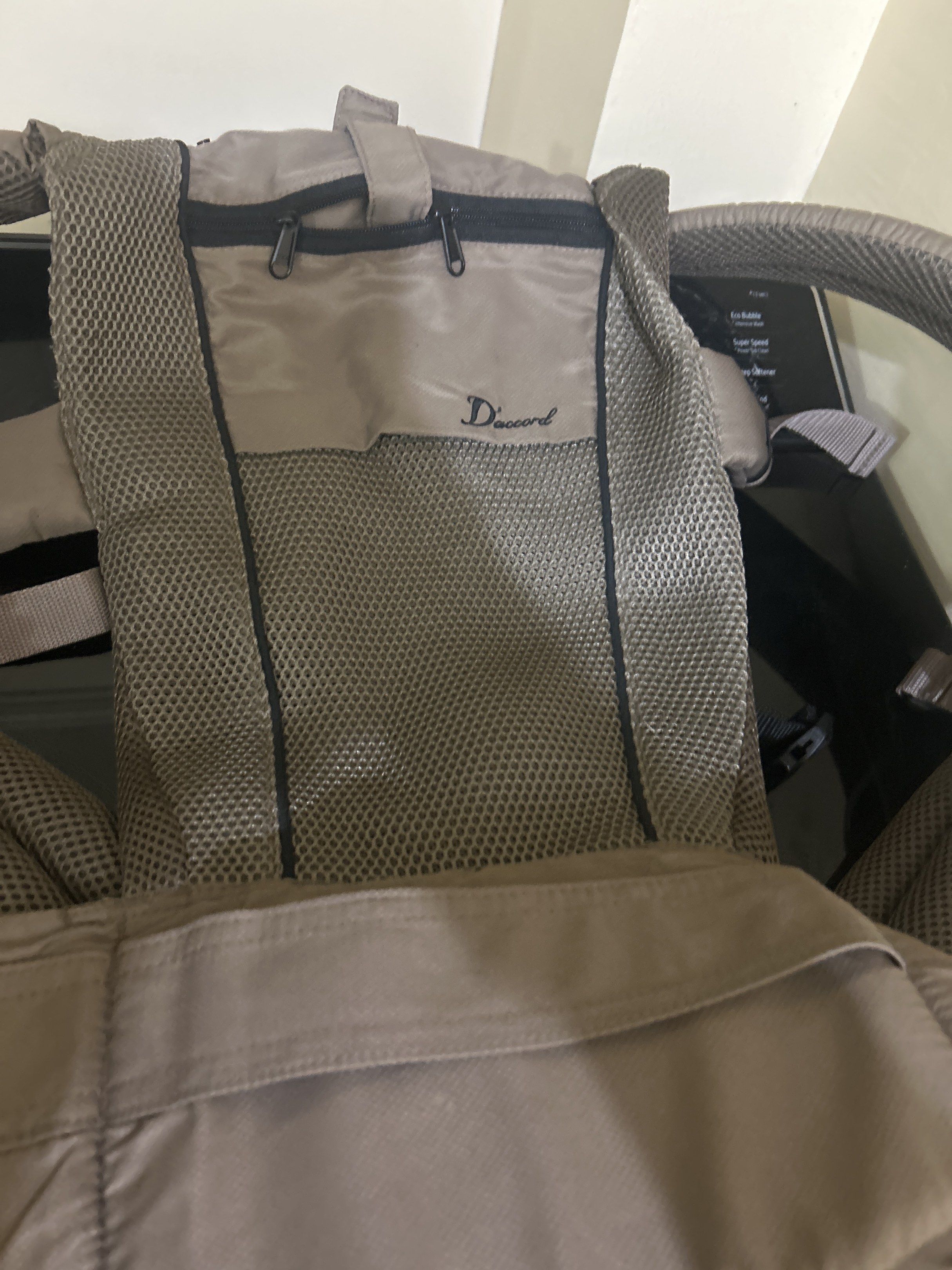 D'accord Baby Carrier (Category: Carriers & Slings) located in Manila. Submitted by coffee52 (Listing ID 1418423919, Image 1). Description: - D'accord baby carrier - Breathable mesh design - Beige color - Zippered pocket for essentials - Adjustable straps for a comfortable fit.