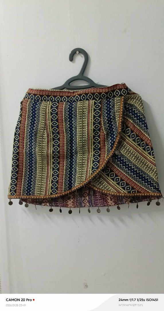Embroidered Wrap Skirt (Category: Skirts) located in Quezon City. Submitted by sheila0721 (Listing ID 1418462277, Image 3). Description: - Colorful embroidered wrap mini skirt - Unique vertical stripes and geometric pattern - Adorned with small embellishments on the hemline - Casual and bohemian style S-M 2pcs Available 300+++ orig price never been used.