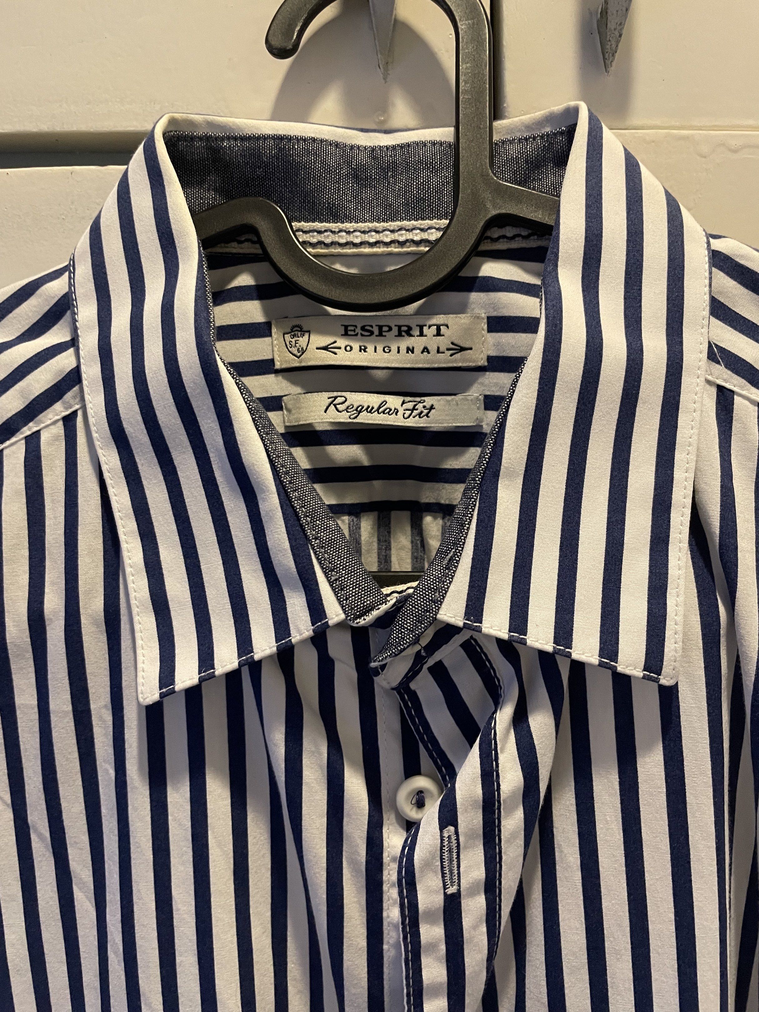Esprit Original Regular Fit Striped Shirt (Category: Tshirts & Polo Shirts ) located in Las Pinas. Submitted by bmtl_ (Listing ID 1418525880, Image 2). Description: - Esprit Original shirt - Regular fit - Classic collar - Short sleeves - Button-down closure - White with navy blue vertical stripes RFS: Decluttering, used once.