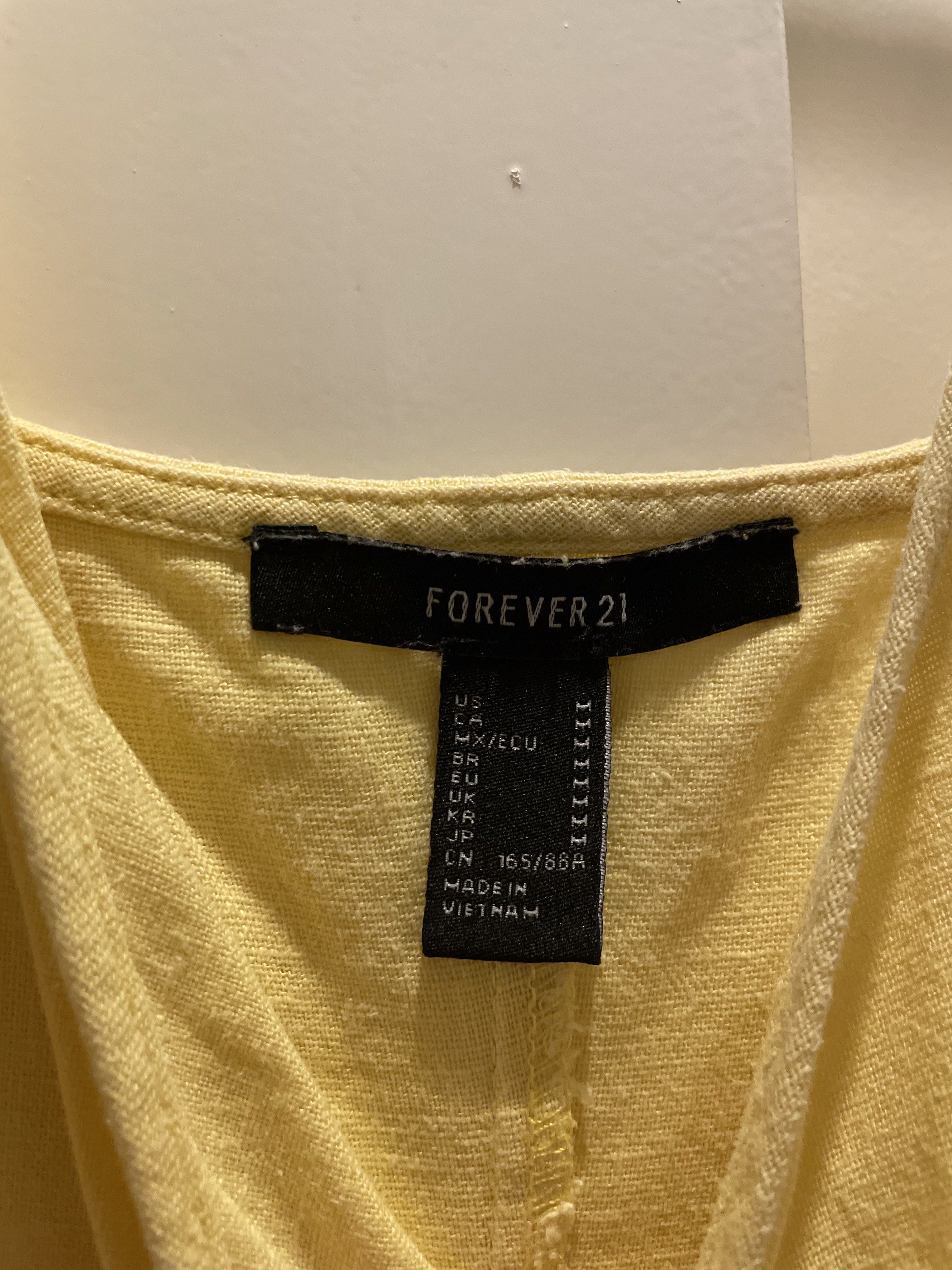 Forever 21 Butter Yellow Button-Down Dress (Category: Dresses) located in Las Pinas. Submitted by bmtl_ (Listing ID 1418563150, Image 3). Description: - Forever 21 dress - Sunny yellow color - Size M - Button-down style - Spaghetti straps and V-neck - Lightweight fabric - Versatile for various occasions RFS: Decluttering.