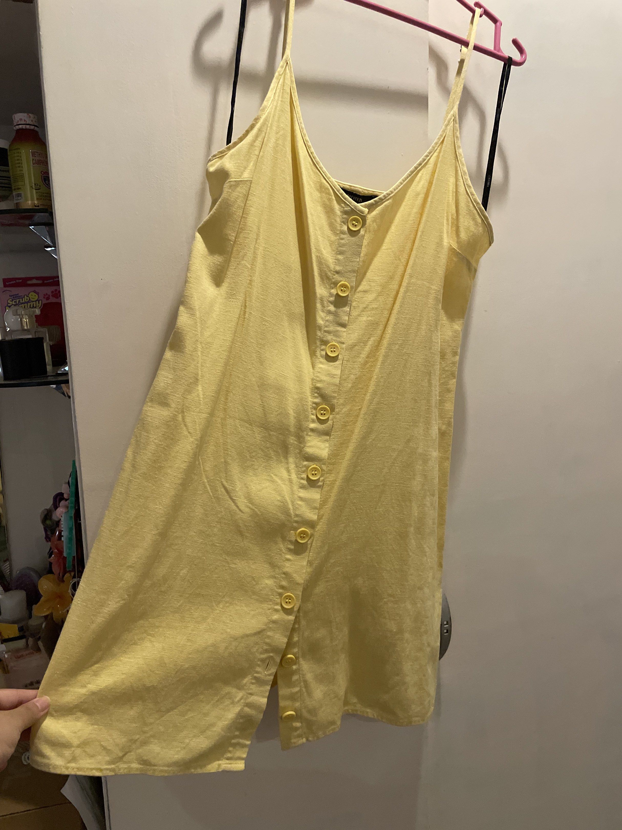 Forever 21 Butter Yellow Button-Down Dress (Category: Dresses) located in Las Pinas. Submitted by bmtl_ (Listing ID 1418563150, Image 2). Description: - Forever 21 dress - Sunny yellow color - Size M - Button-down style - Spaghetti straps and V-neck - Lightweight fabric - Versatile for various occasions RFS: Decluttering.