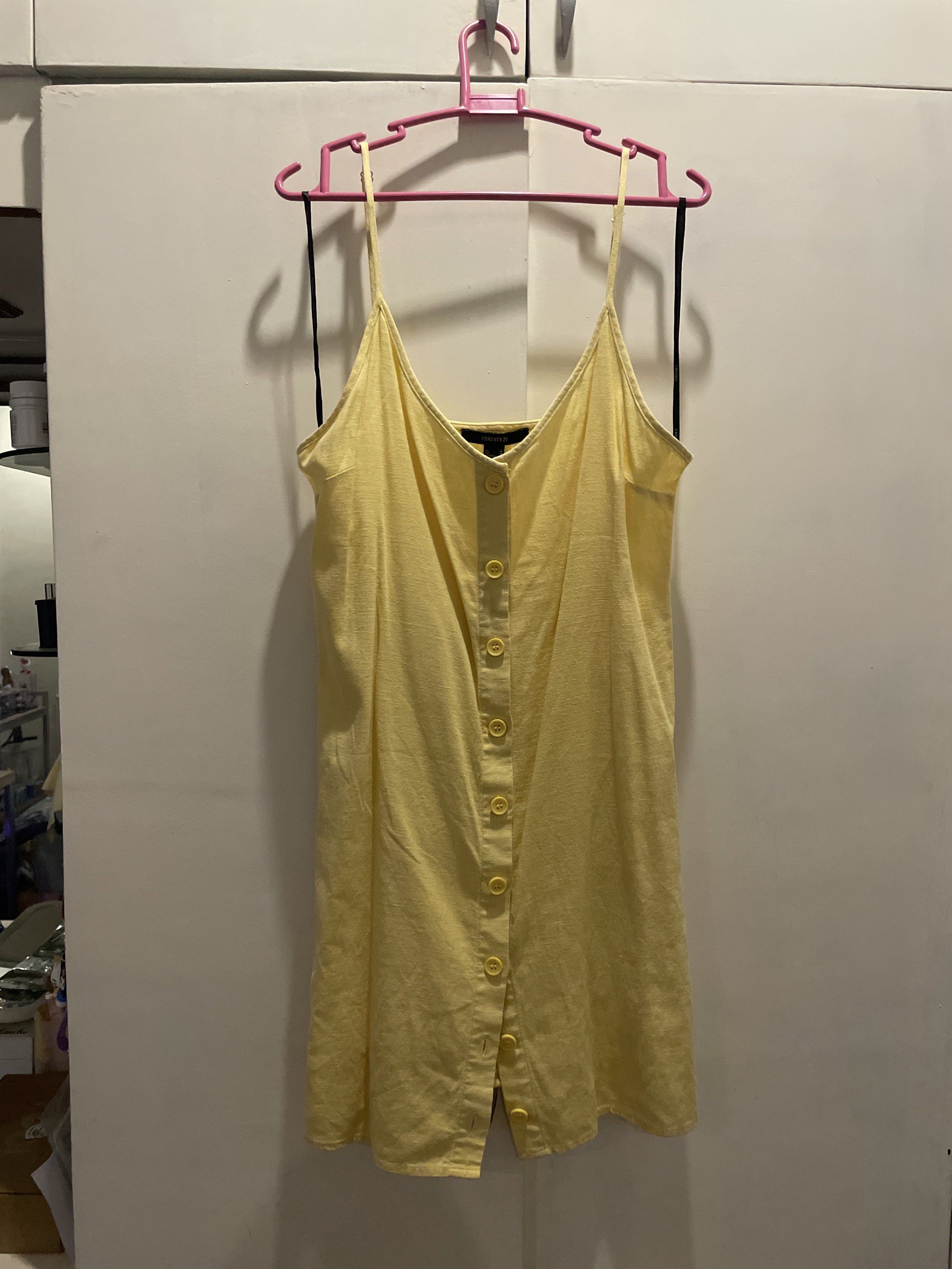 Forever 21 Butter Yellow Button-Down Dress (Category: Dresses) located in Las Pinas. Submitted by bmtl_ (Listing ID 1418563150, Image 1). Description: - Forever 21 dress - Sunny yellow color - Size M - Button-down style - Spaghetti straps and V-neck - Lightweight fabric - Versatile for various occasions RFS: Decluttering.