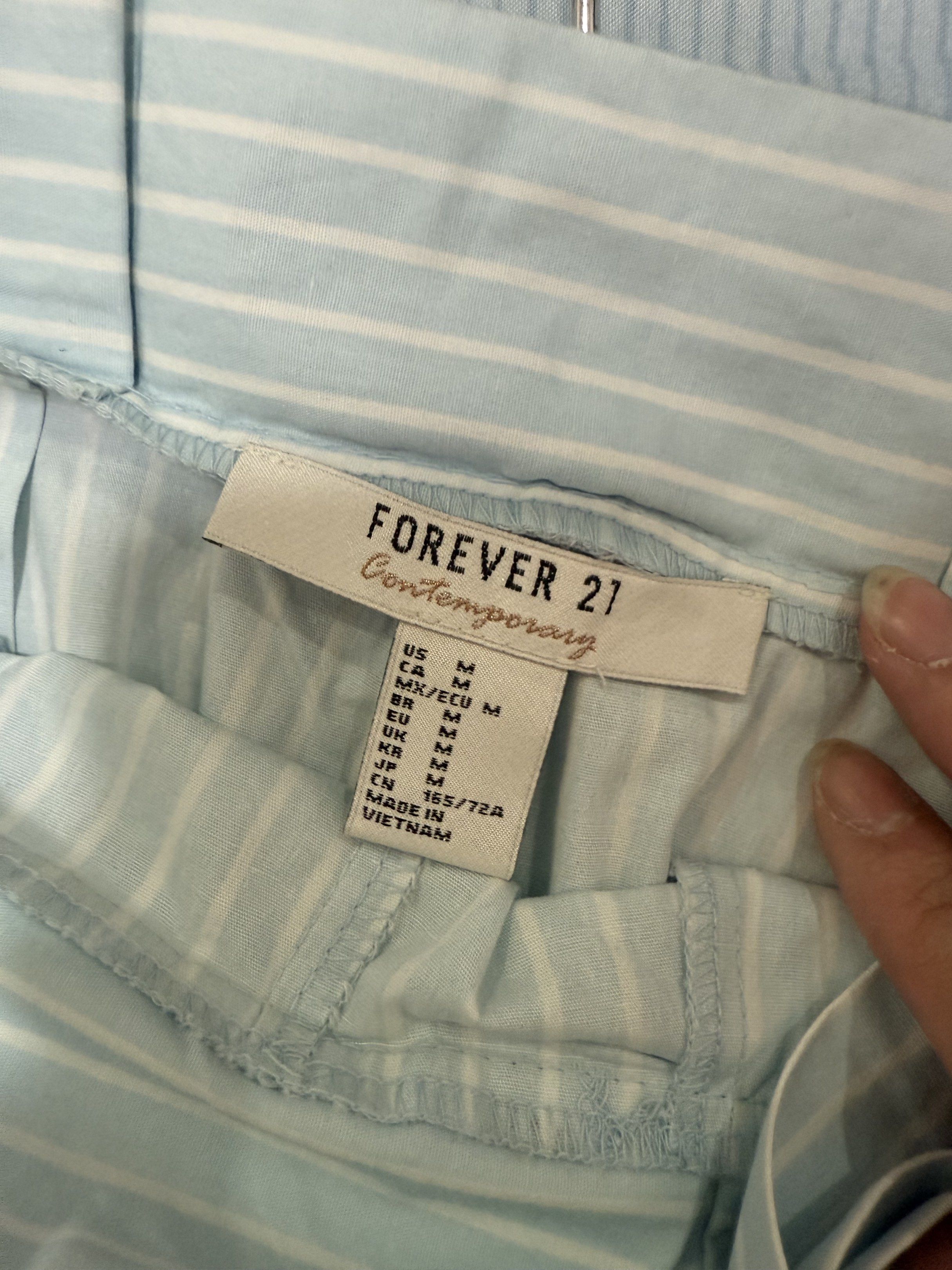 Forever 21 Striped Shorts - Size M (Category: Shorts) located in Las Pinas. Submitted by kva13 (Listing ID 1418425713, Image 2). Description: - Forever 21 shorts - Light blue and white stripes - High-waisted design - Tie detail - Size: M.