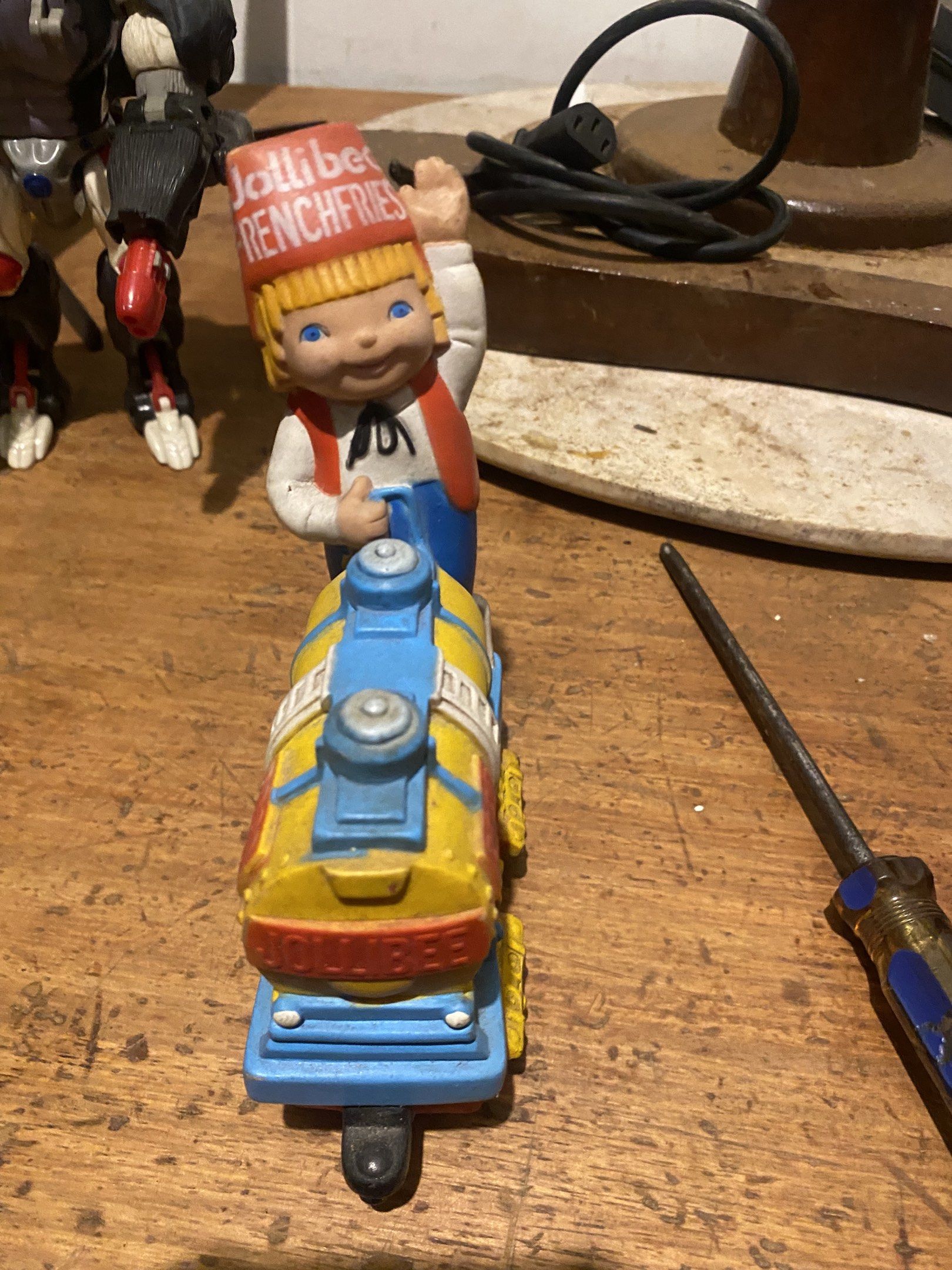Jollibee Train Toy (Category: Vintage Collectibles) located in Manila. Submitted by jtv17 (Listing ID 1418447516, Image 1). Description: - Vintage Jollibee train toy - Features the iconic Jollibee character - Yellow and blue train design - Includes Jollibee figure waving - Perfect for Jollibee enthusiasts and toy collectors.