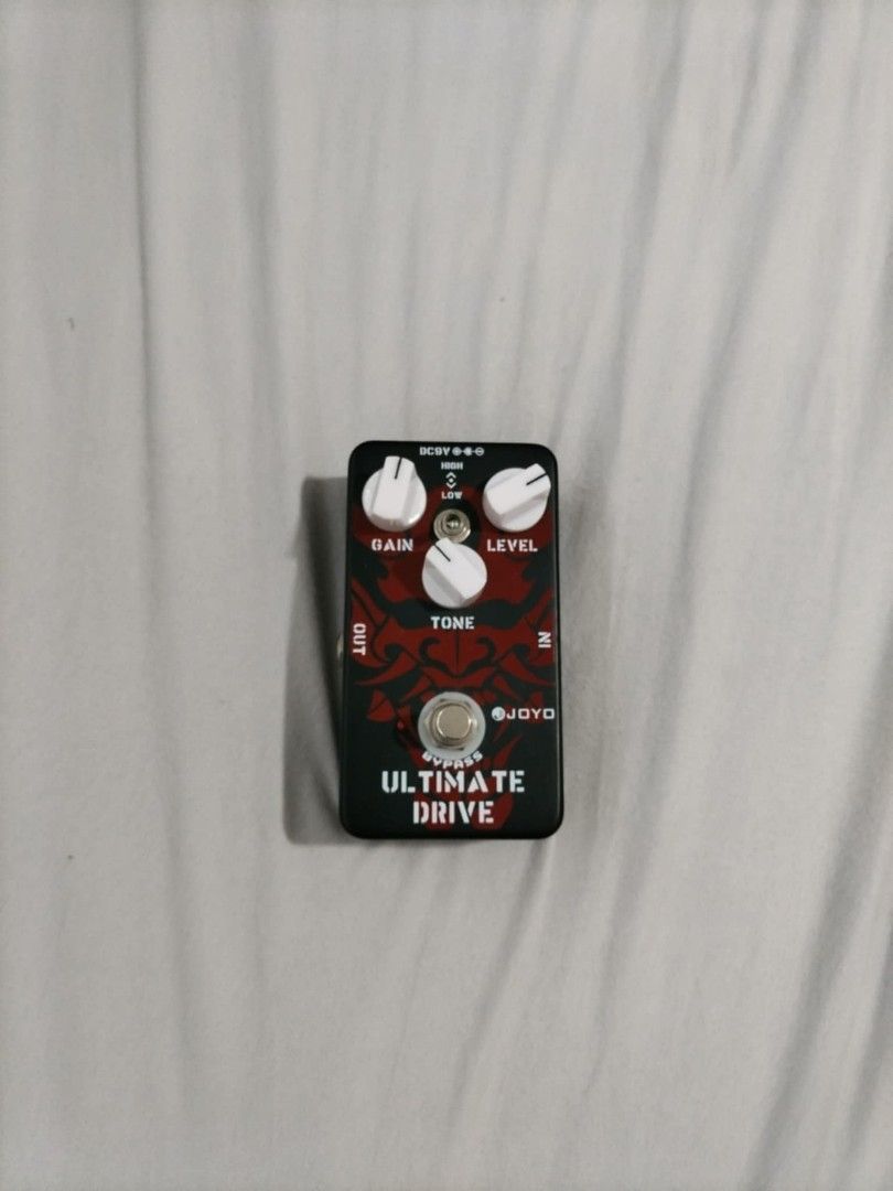 Joyo Ultimate Drive Guitar Pedal (Category: Musical Instruments) located in Las Pinas. Submitted by lilypod85 (Listing ID 1418555628, Image 2). Description: - Joyo Ultimate Drive guitar pedal - Gain, Level, and Tone controls - Input and Output jacks - Bypass switch - Black finish with white knobs and red graphic - Powered by DC 9V adapter (not included) - Velcro attached to the bottom - Delivers excellent overdrive tones.