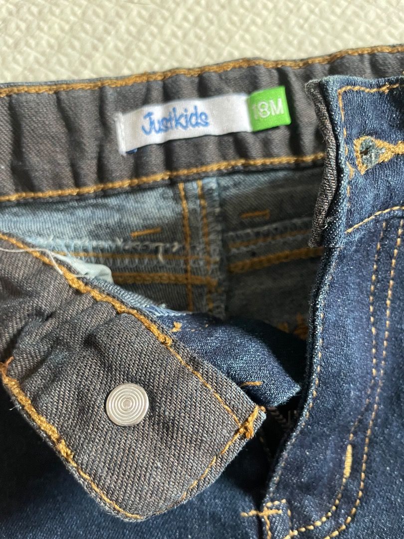 Justkids 18M Denim Jeans (Category: Babies & Kids Fashion) located in Casiguran. Submitted by roseromano (Listing ID 1418436339, Image 3). Description: - Justkids denim jeans - Size: 18 months - Classic five-pocket design - Button and zipper closure - Dark blue wash - Visible stitching details - Well-maintained condition.