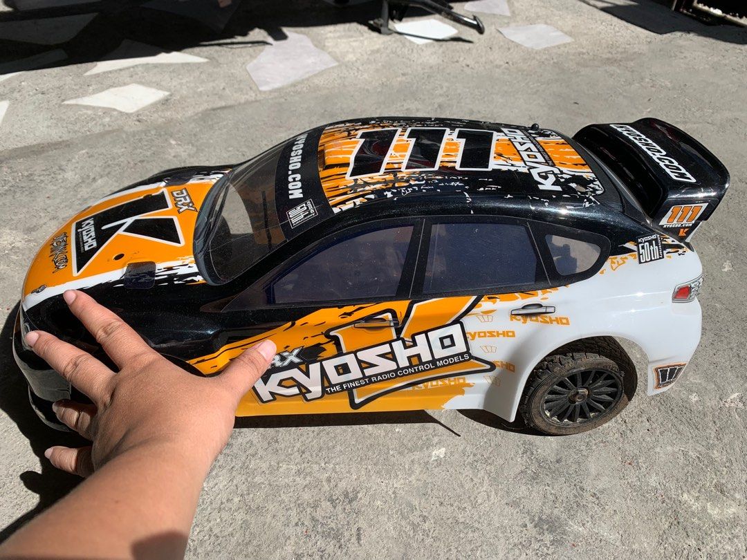 Kyosho DRX Subaru RC Car (Category: Remote Control Toys) located in Manila. Submitted by miah_collectiblesurplus (Listing ID 1418534990, Image 3). Description: 15,000 pesos Location: Valenzuela Kyosho DRX 1/9 Scale Subaru Impreza radio-controlled rally car Untested wala remote Pero working motor From Japan item as is.
